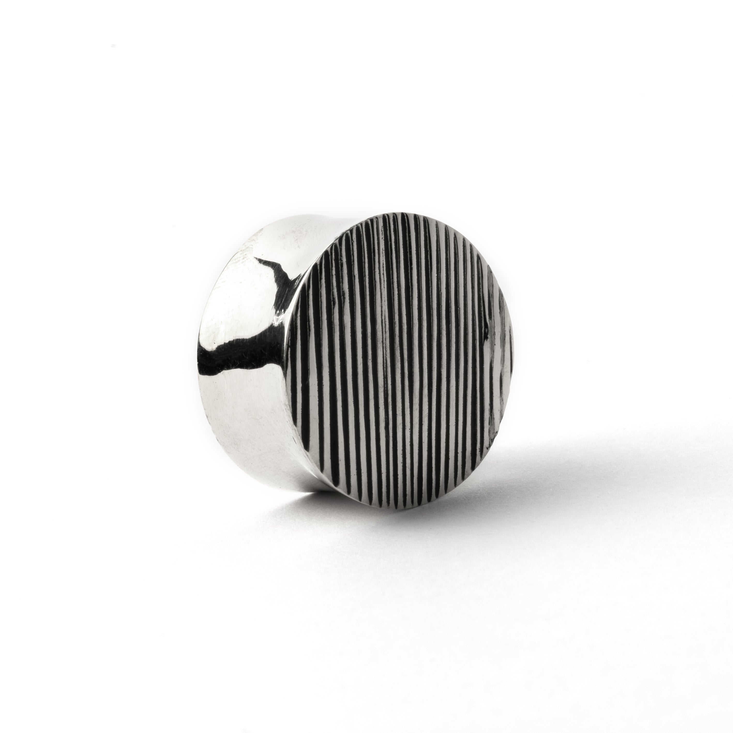 single scratched double flared ear plug lest front view