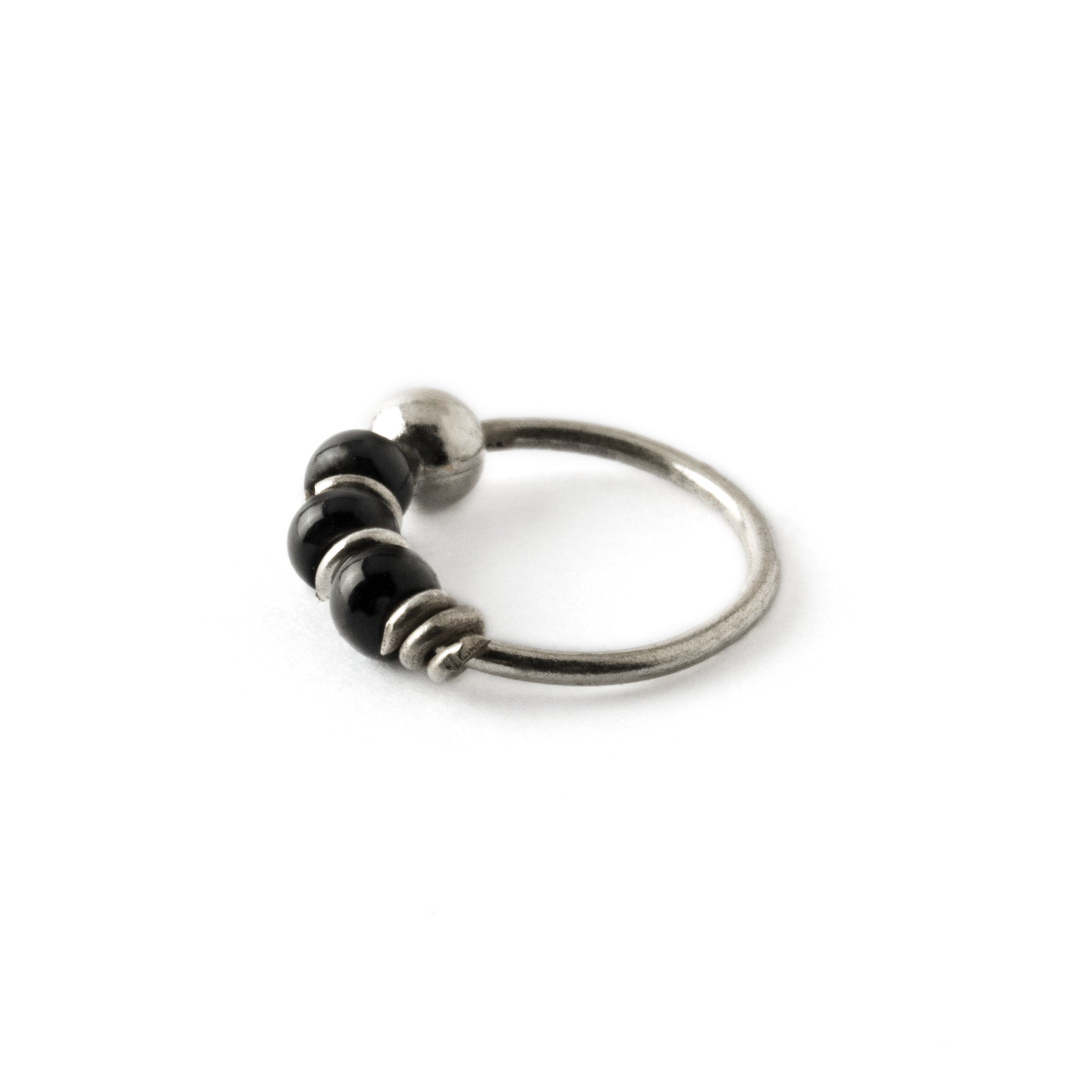 Silver nose ring with black onyx beads side view