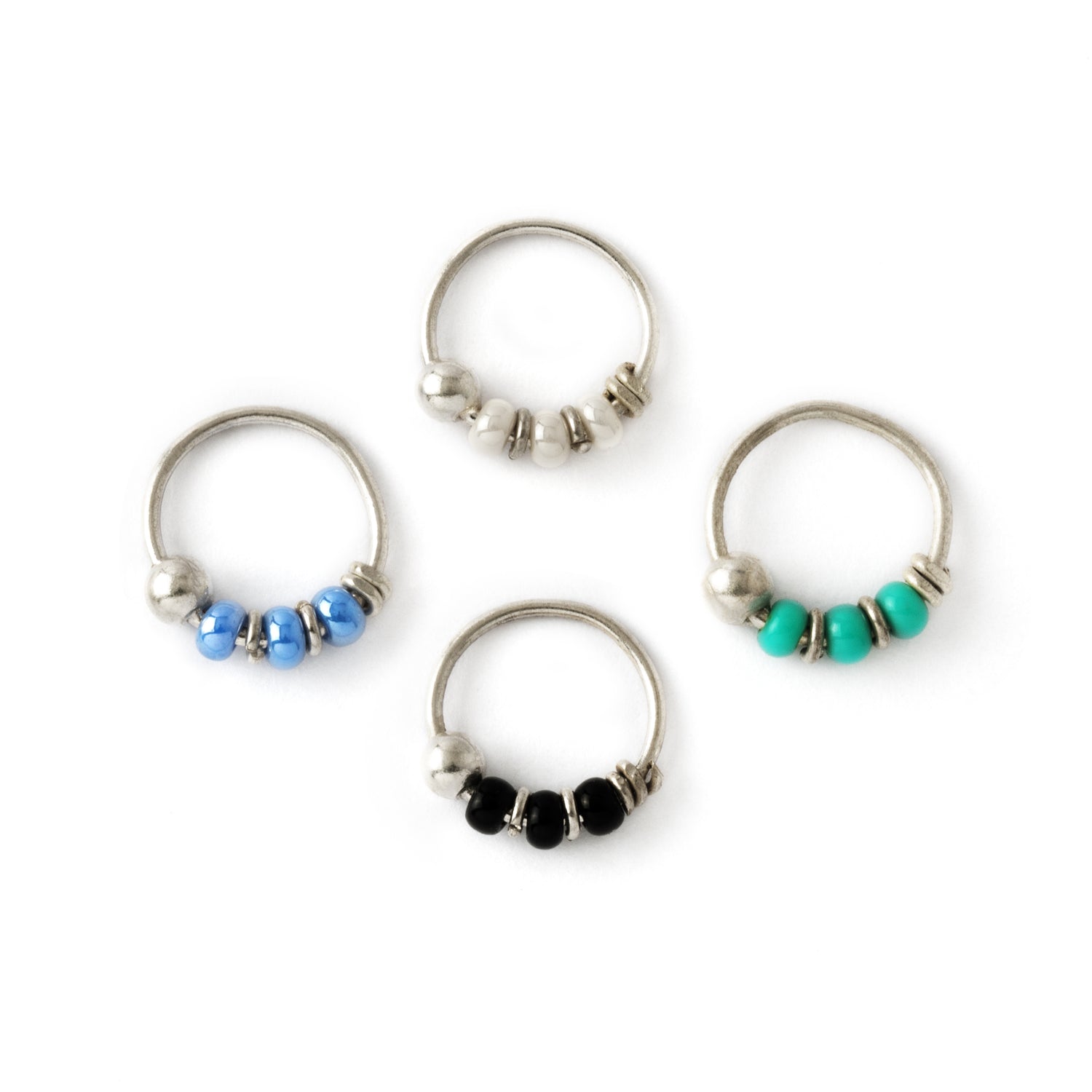 Silver nose rings with different types beads frontal view