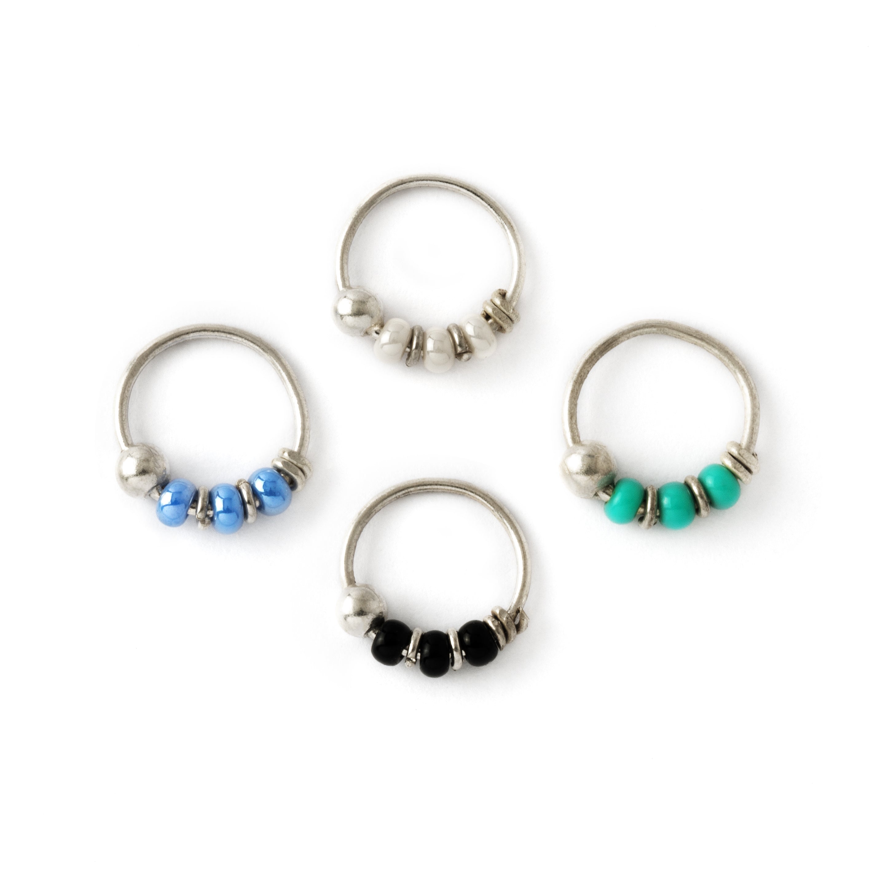 Silver nose rings with different types beads frontal view