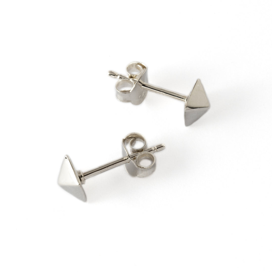 pair of Silver pyramid ear studs left and right side view
