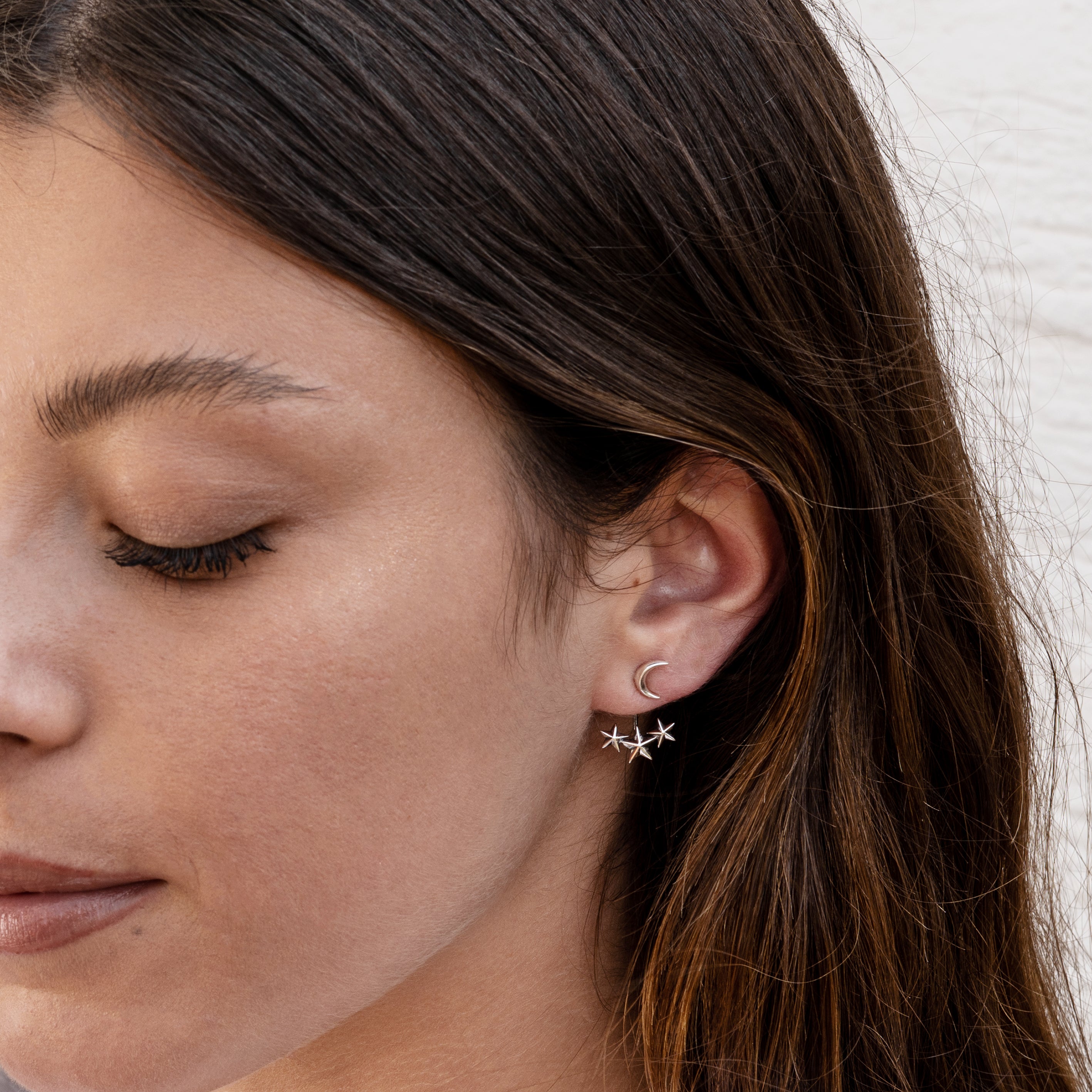 model wearing Celestial silver ear jackets 