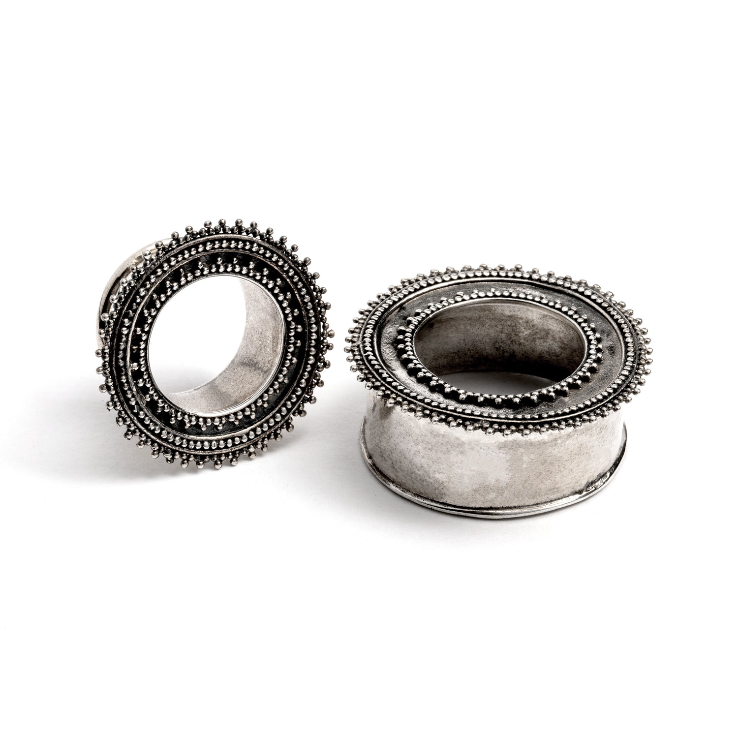 pair of silver Indian ear tunnels front and side view