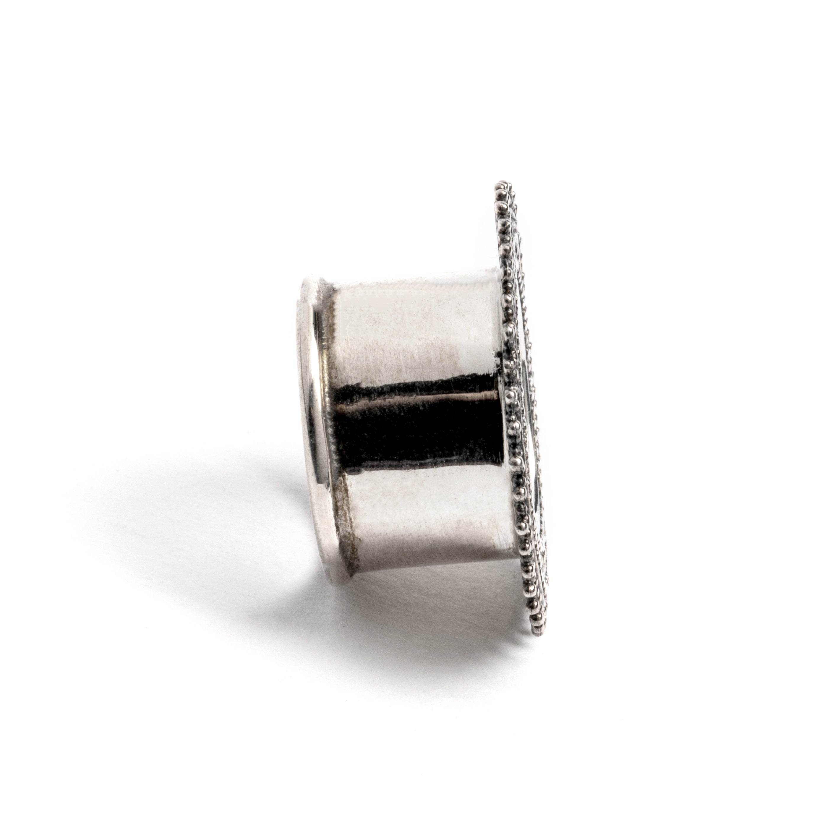 single silver Indian ear tunnel side view