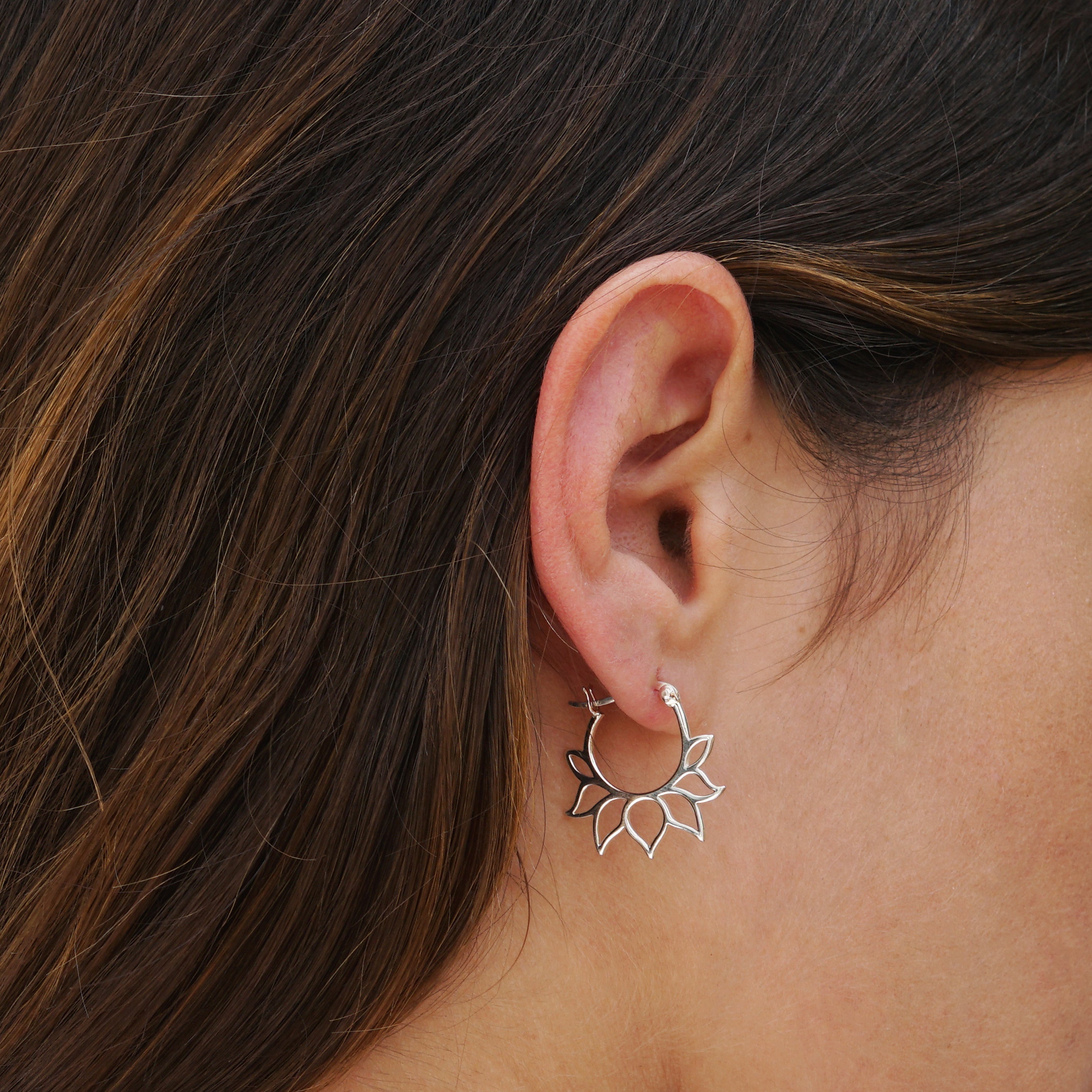 model wearing Silver Lotus Petal Hoops 