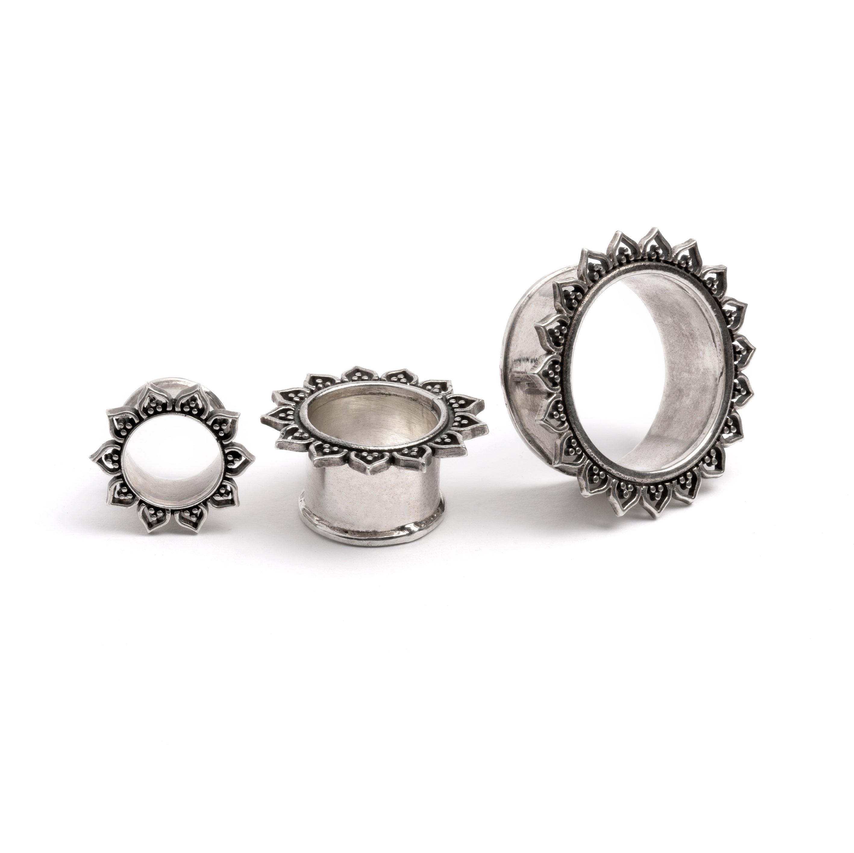 three sizes of Iriya Lotus Petals Silver ear tunnels frontal view