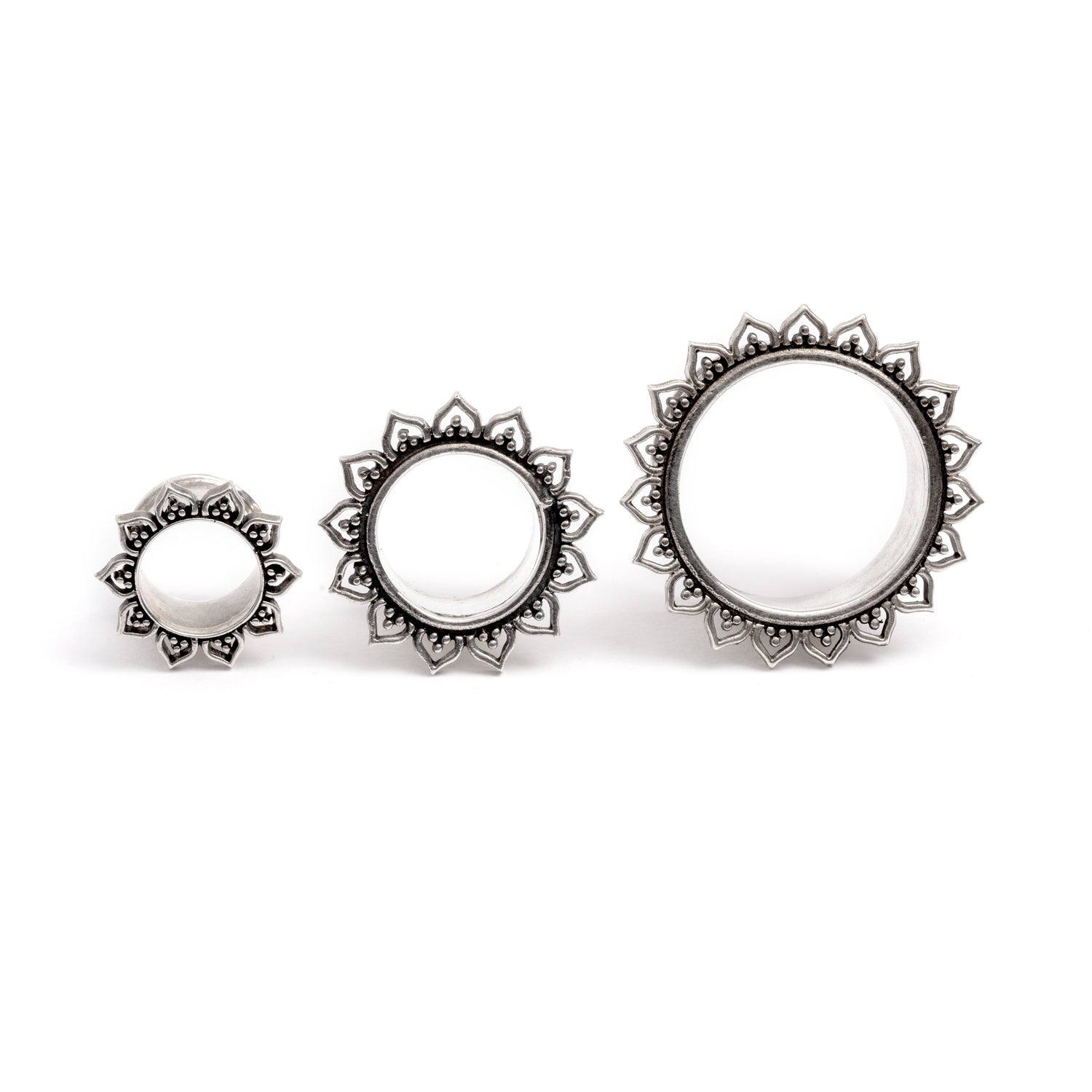 three sizes of Iriya Lotus Petals Silver ear tunnels frontal view