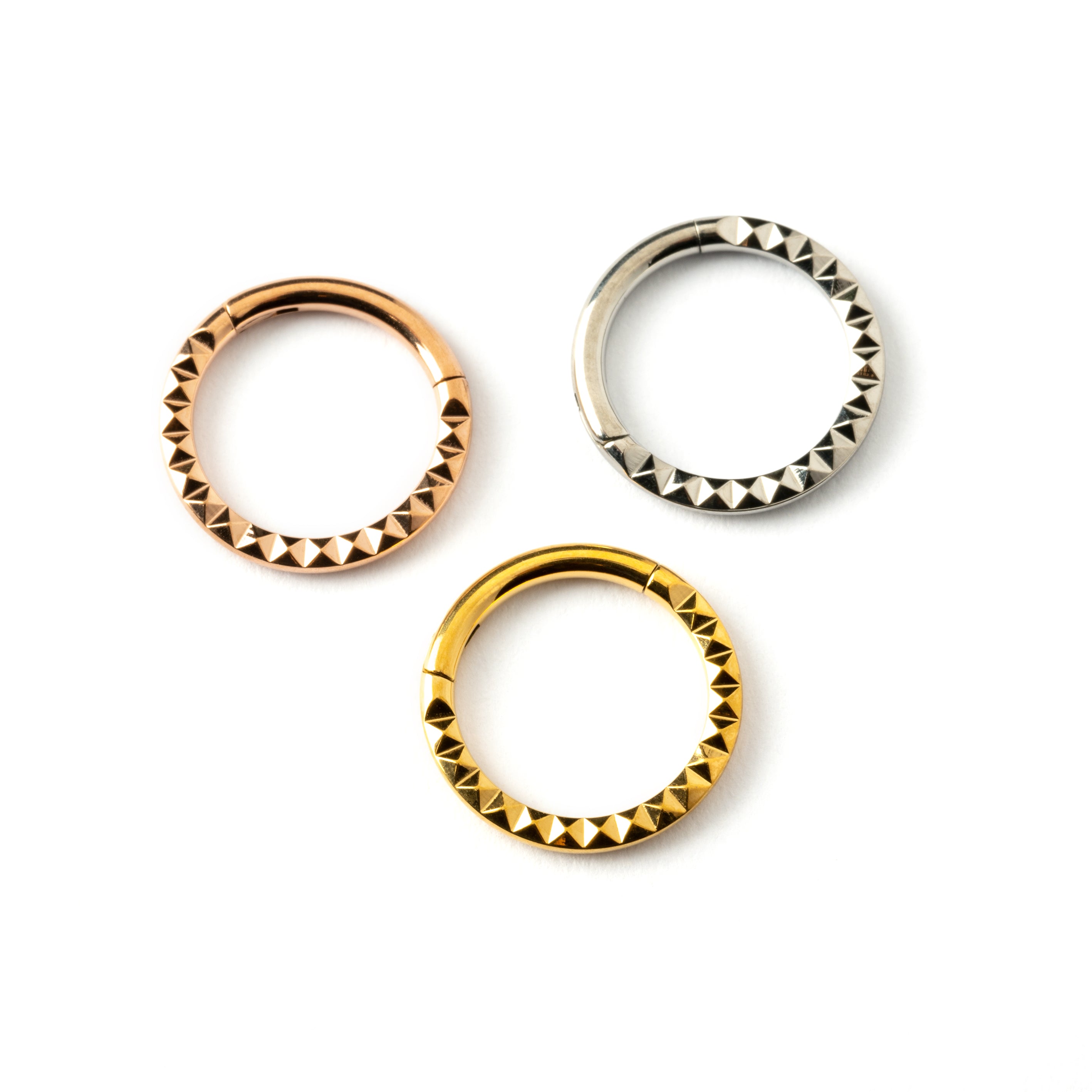 Giza gold, rose gold surgical steel clicker ring with 3d pyramid patter frontal view