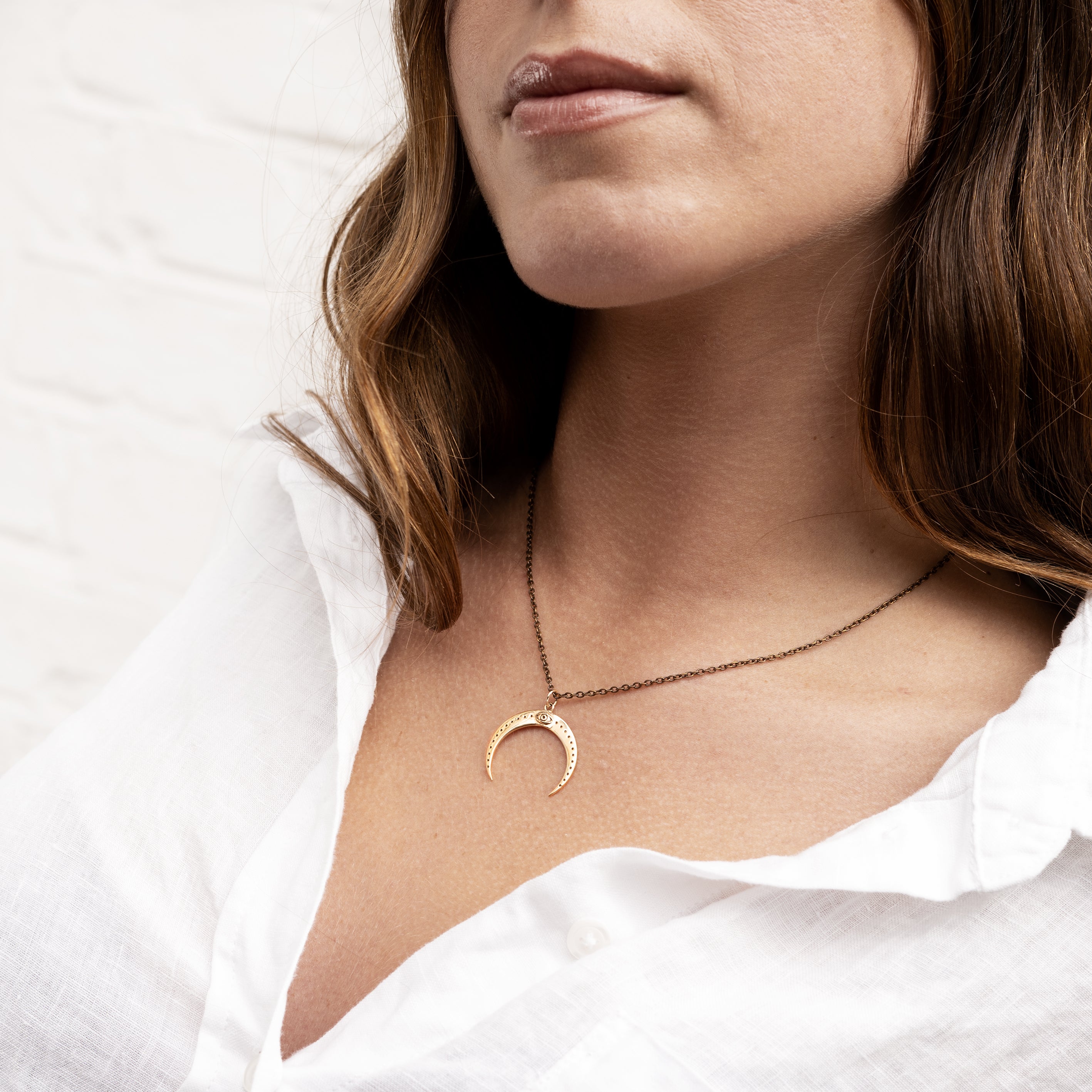 model wearing Bronze All Seeing Eye Moon Pendant necklace