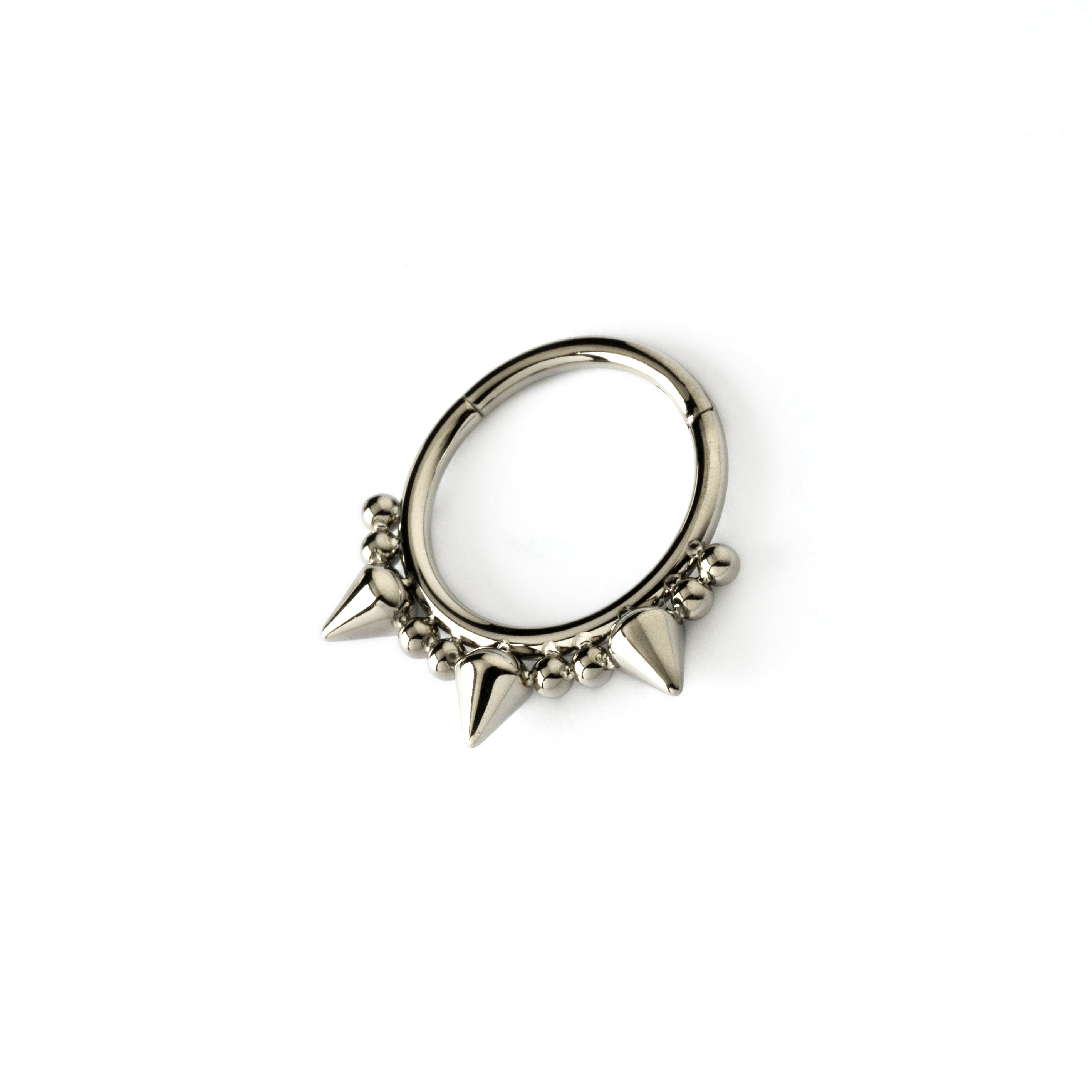 surgical steel clicker ring ornamented with spheres and spikes left side view