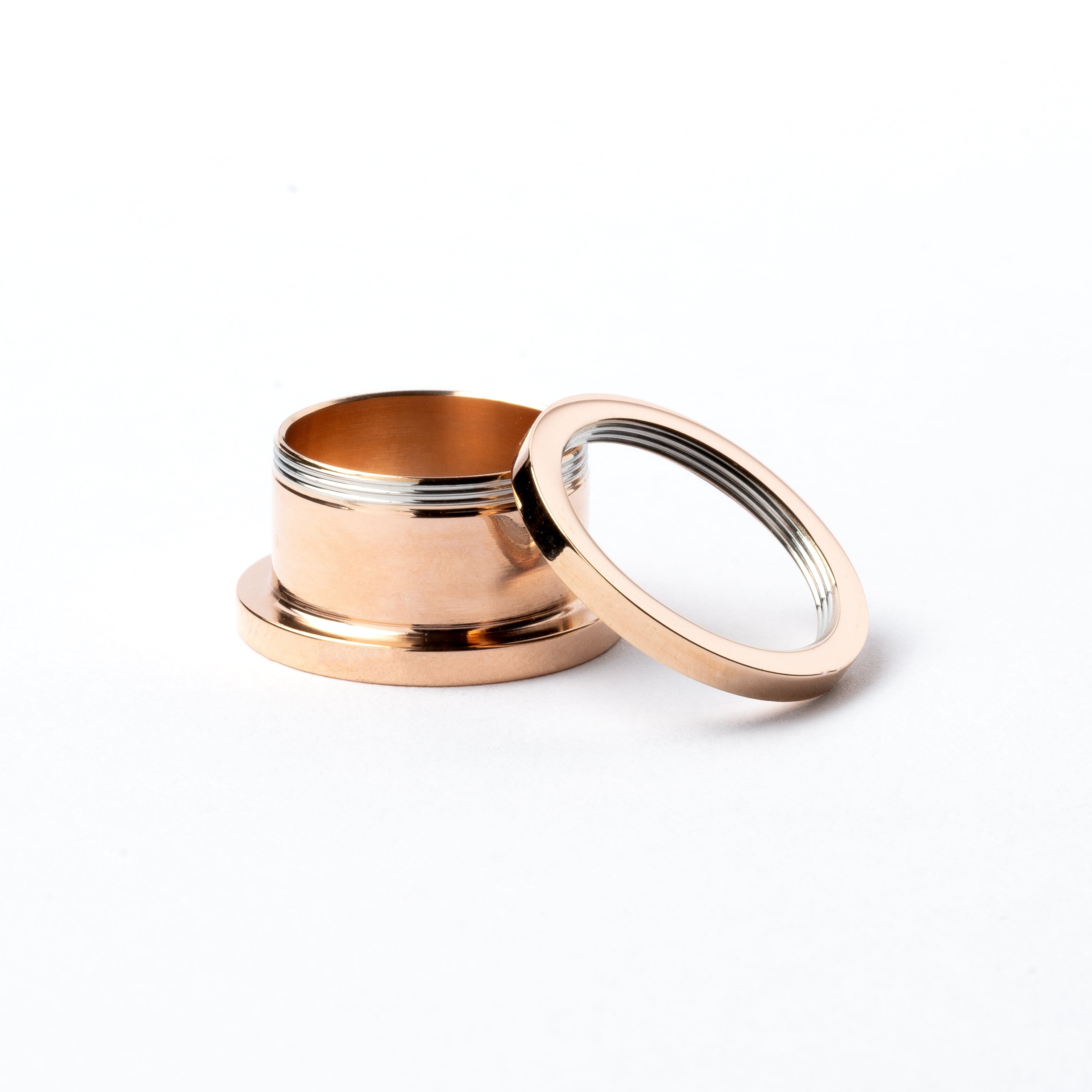 single rose gold surgical steel ear tunnel with double flared ends screw back closure view