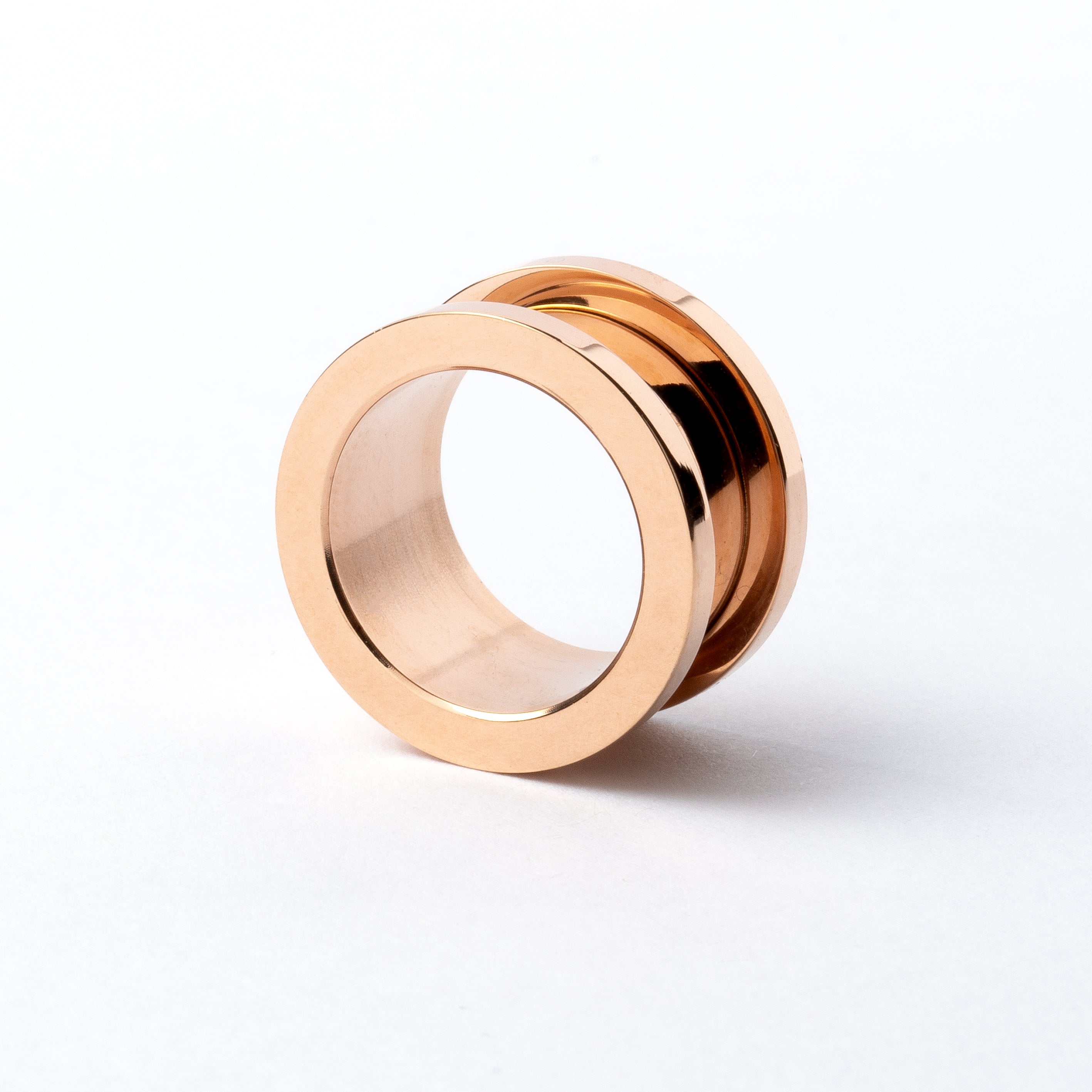 single rose gold surgical steel ear tunnel with double flared ends back view