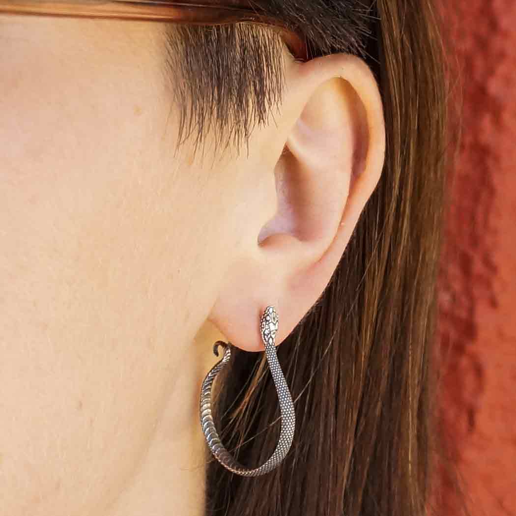 model wearing Snake open Hoops Earrings