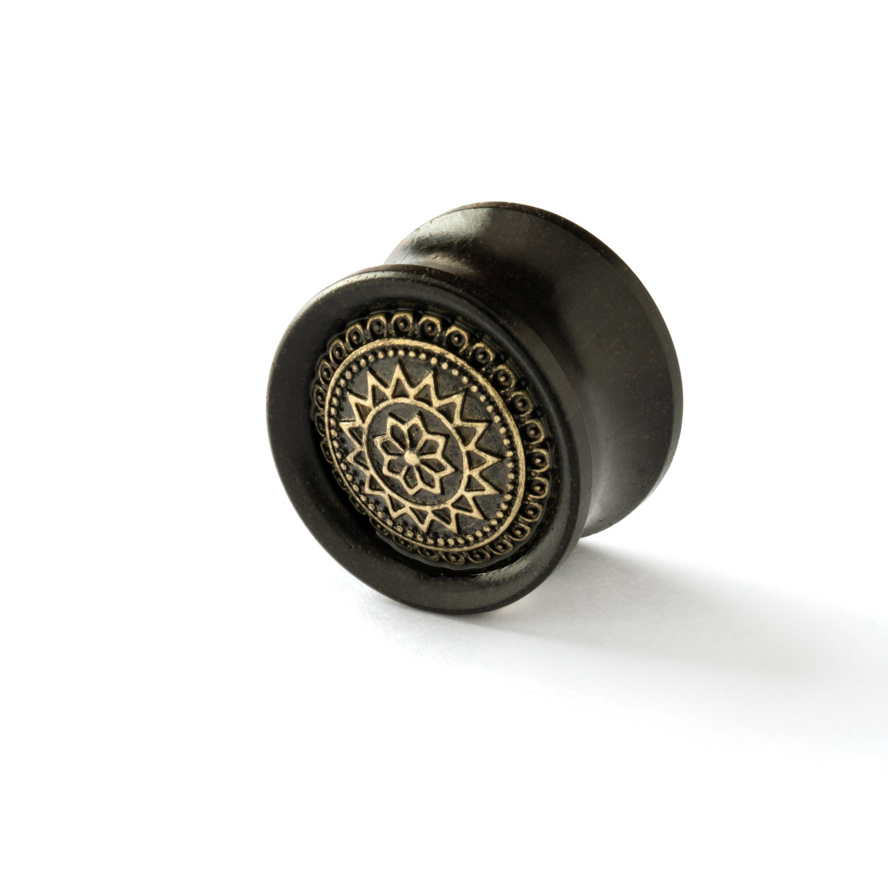 ebony wood ear plug with brass tribal flower ornament