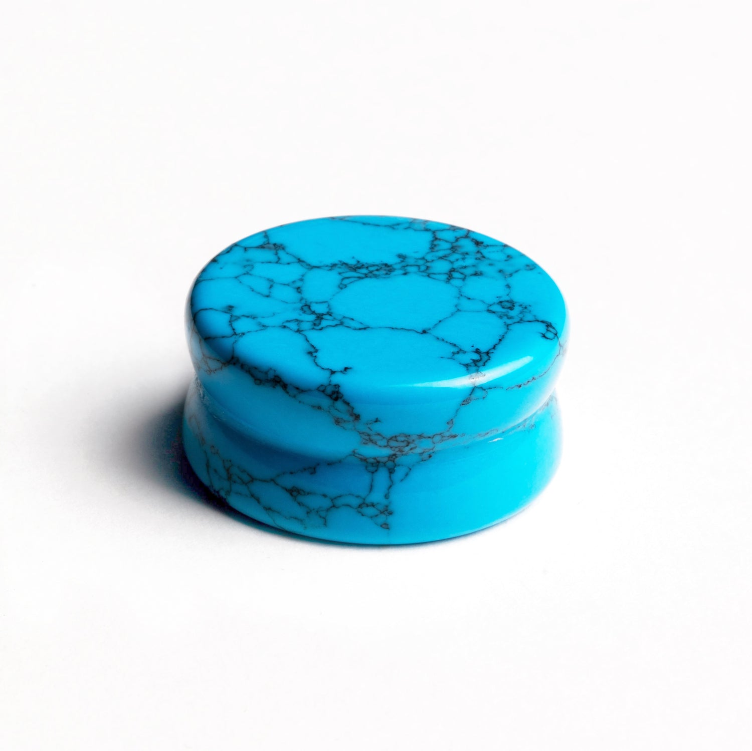 single turquoise double flared stone ear plug front view