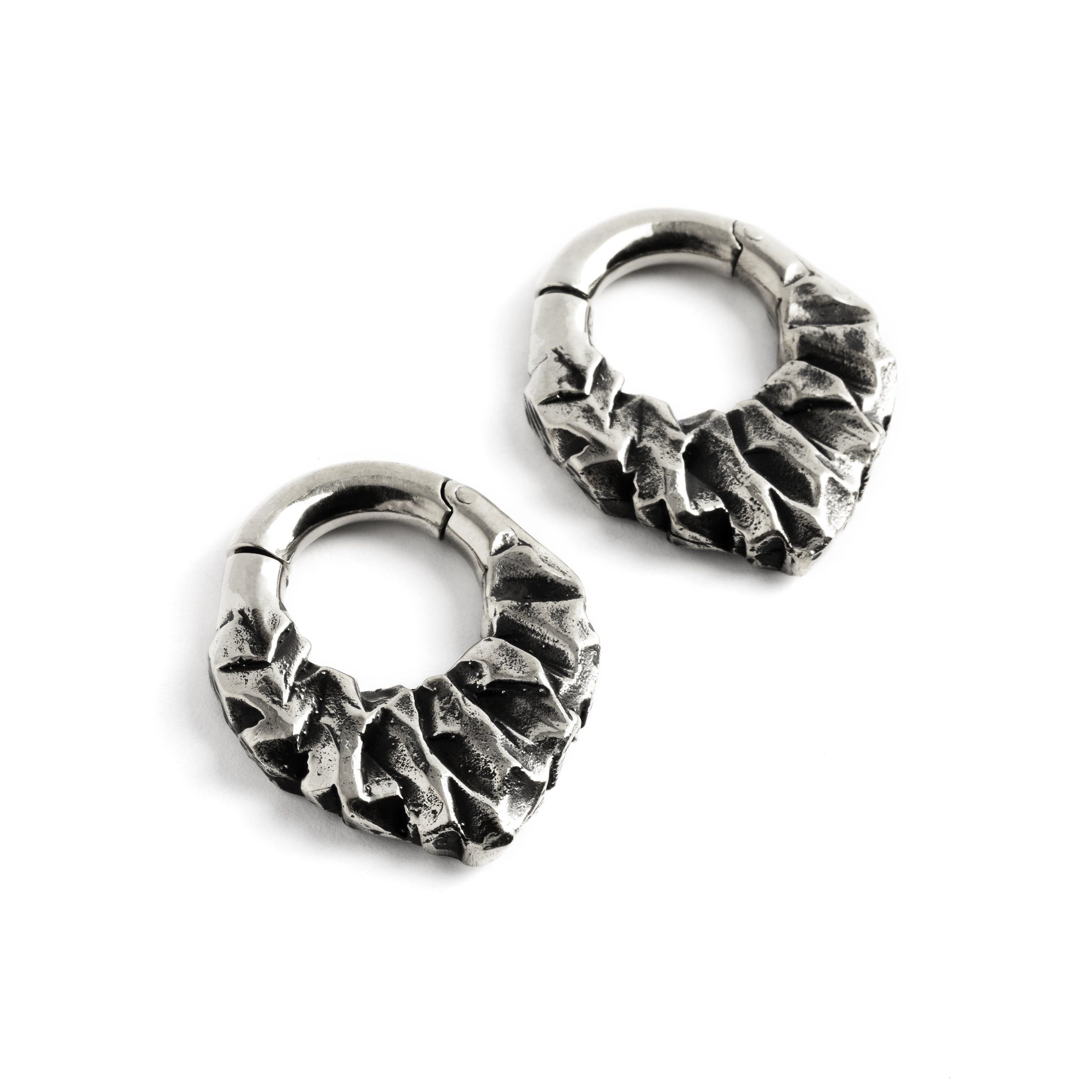 pair of silver brass teardrop shaped ear hoops hangers with rocky texture right front view
