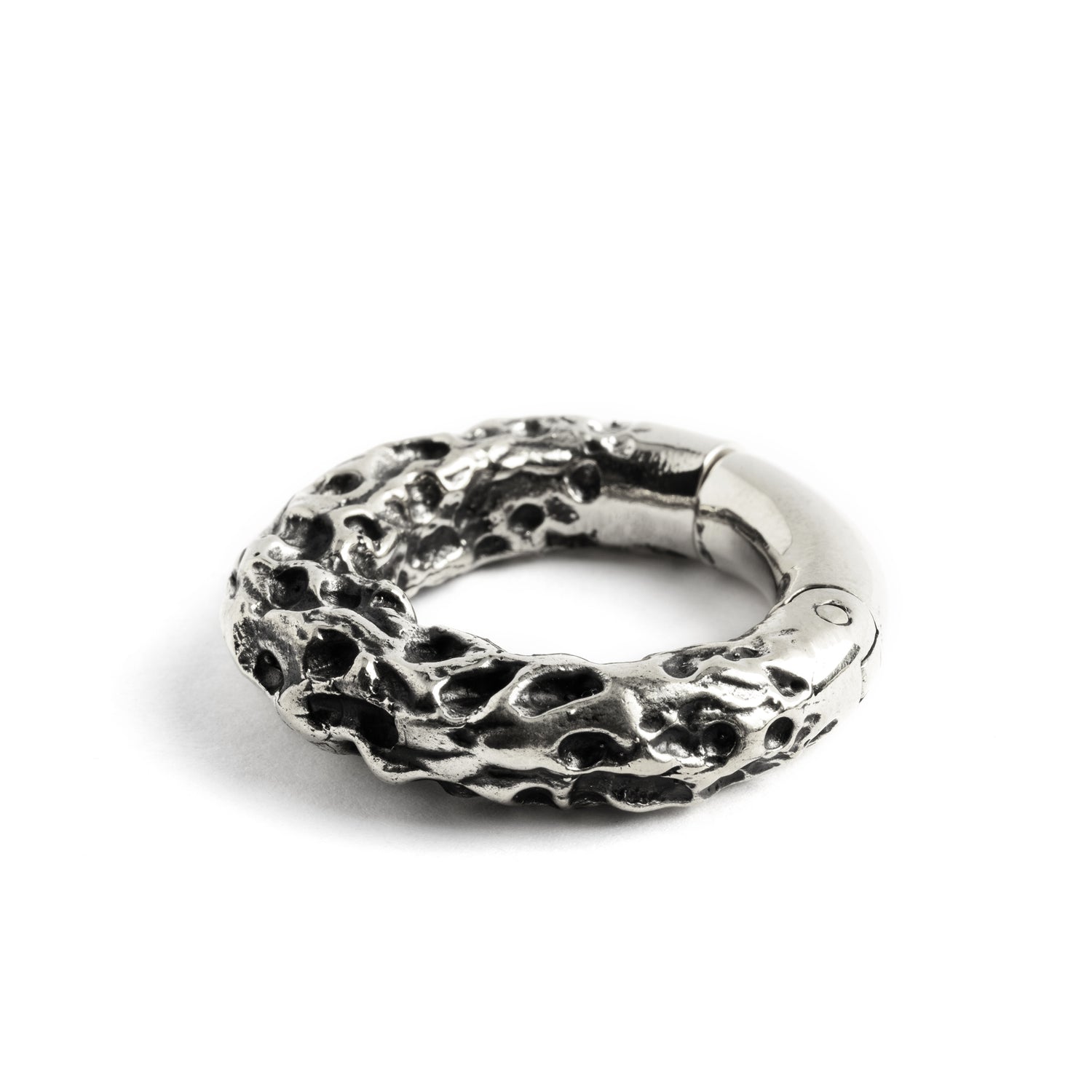 single white brass hoop hanger with rocky texture side close up view