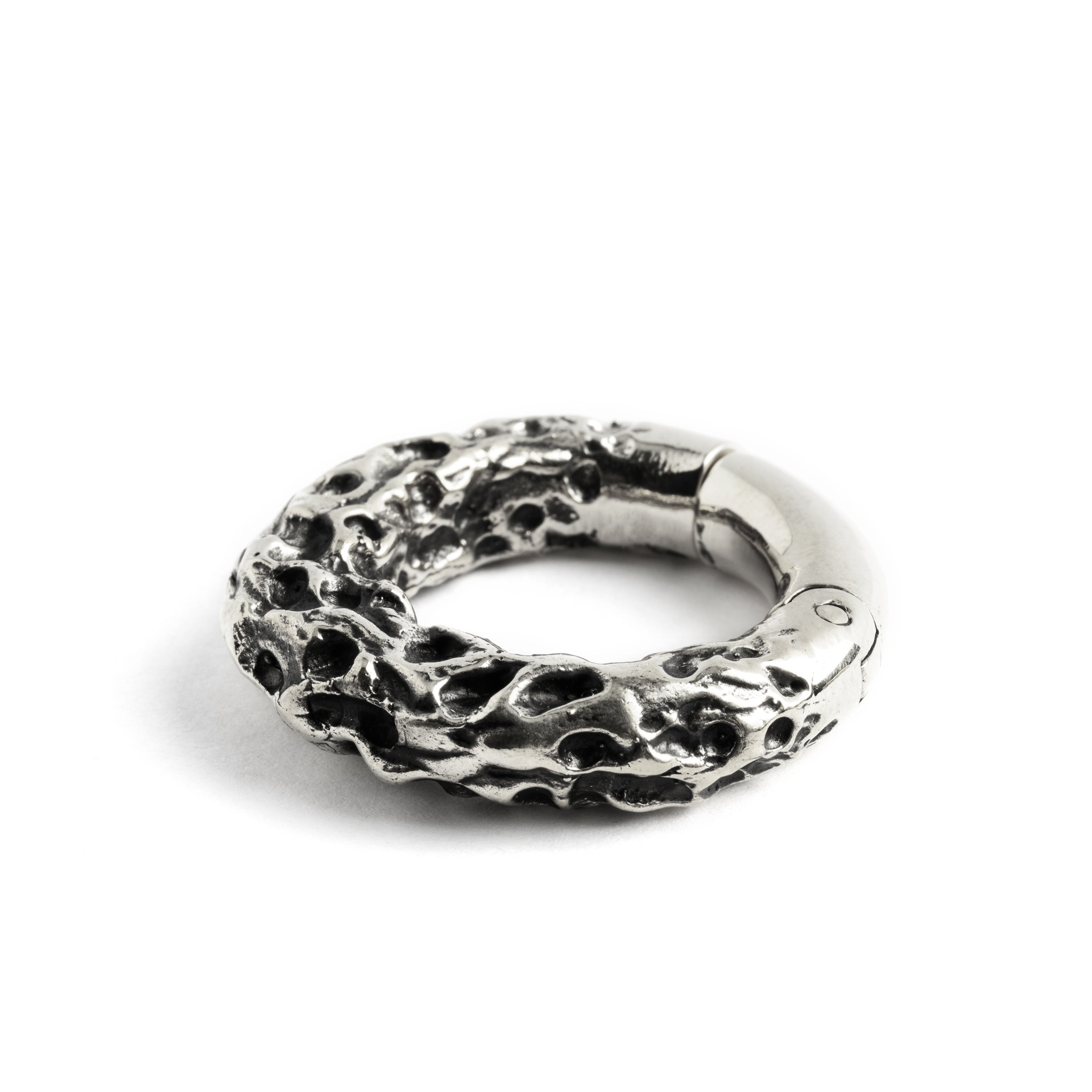 single white brass hoop hanger with rocky texture side close up view