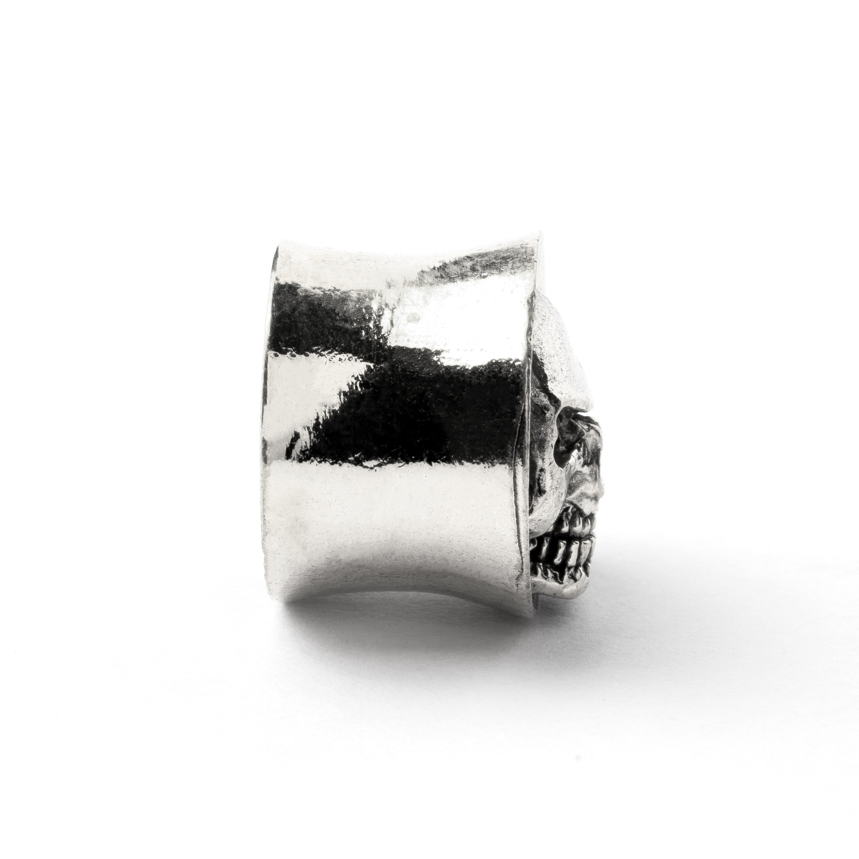 White brass skull ear plug side view