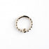 sterling silver dotted septum ring with white Topaz gemstone frontal view
