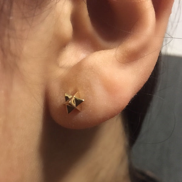 model wearing Bronze Merkaba Ear Studs