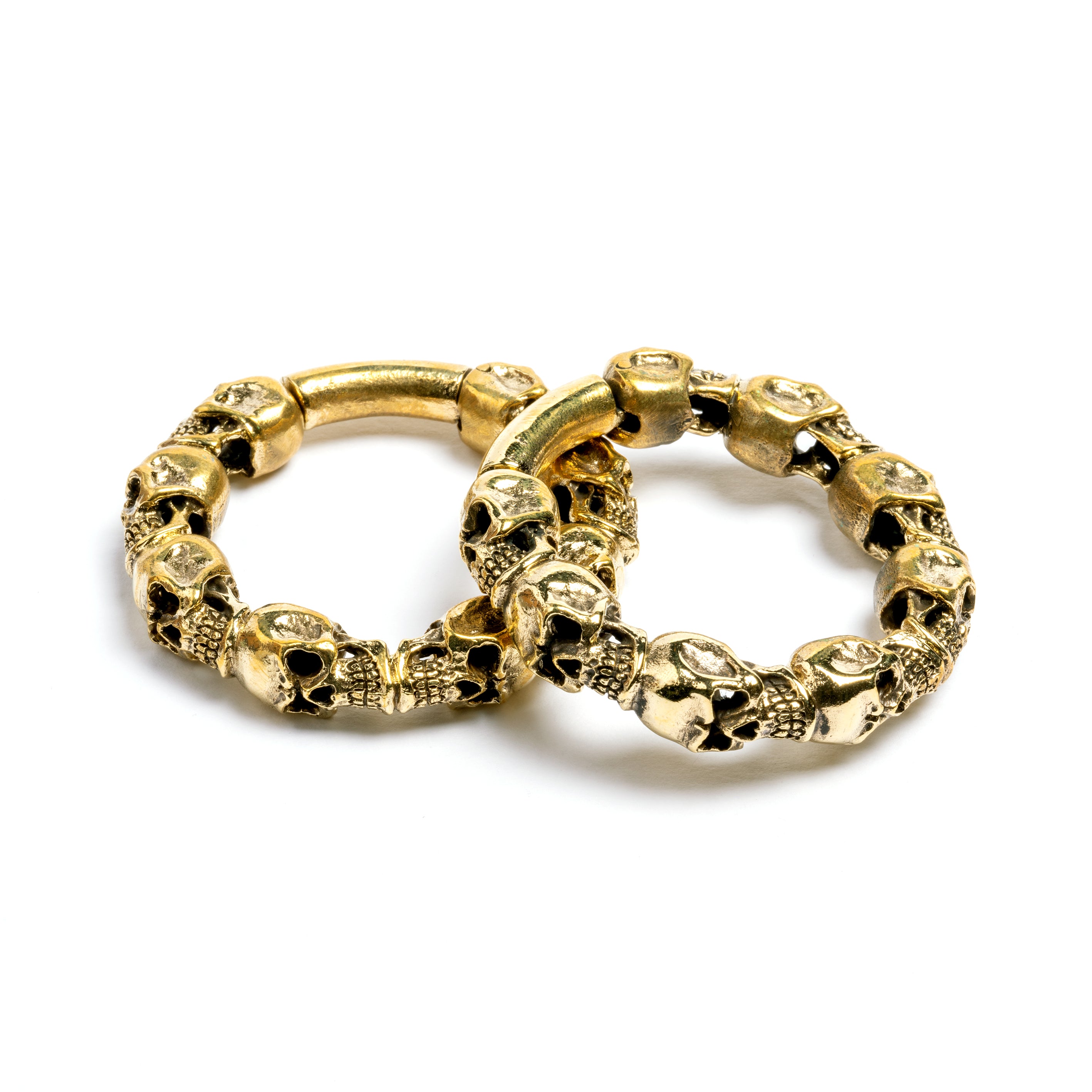 pair of gold brass skulls band hoop gauges side and front view