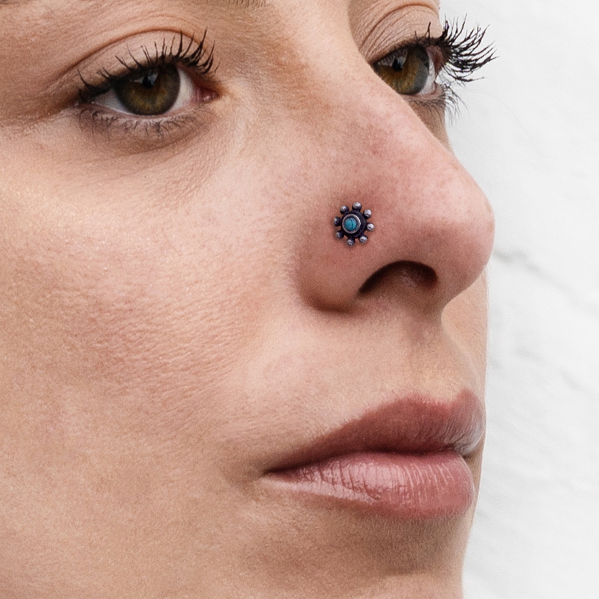 model wearing Daisy silver nose stud 