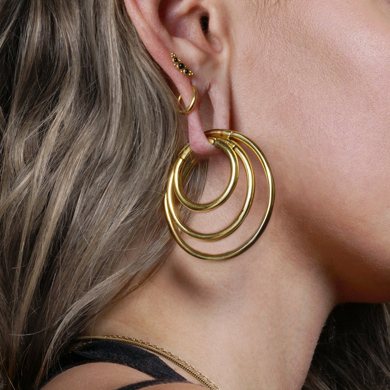 model wearing Golden Stacking Hoop Hangers