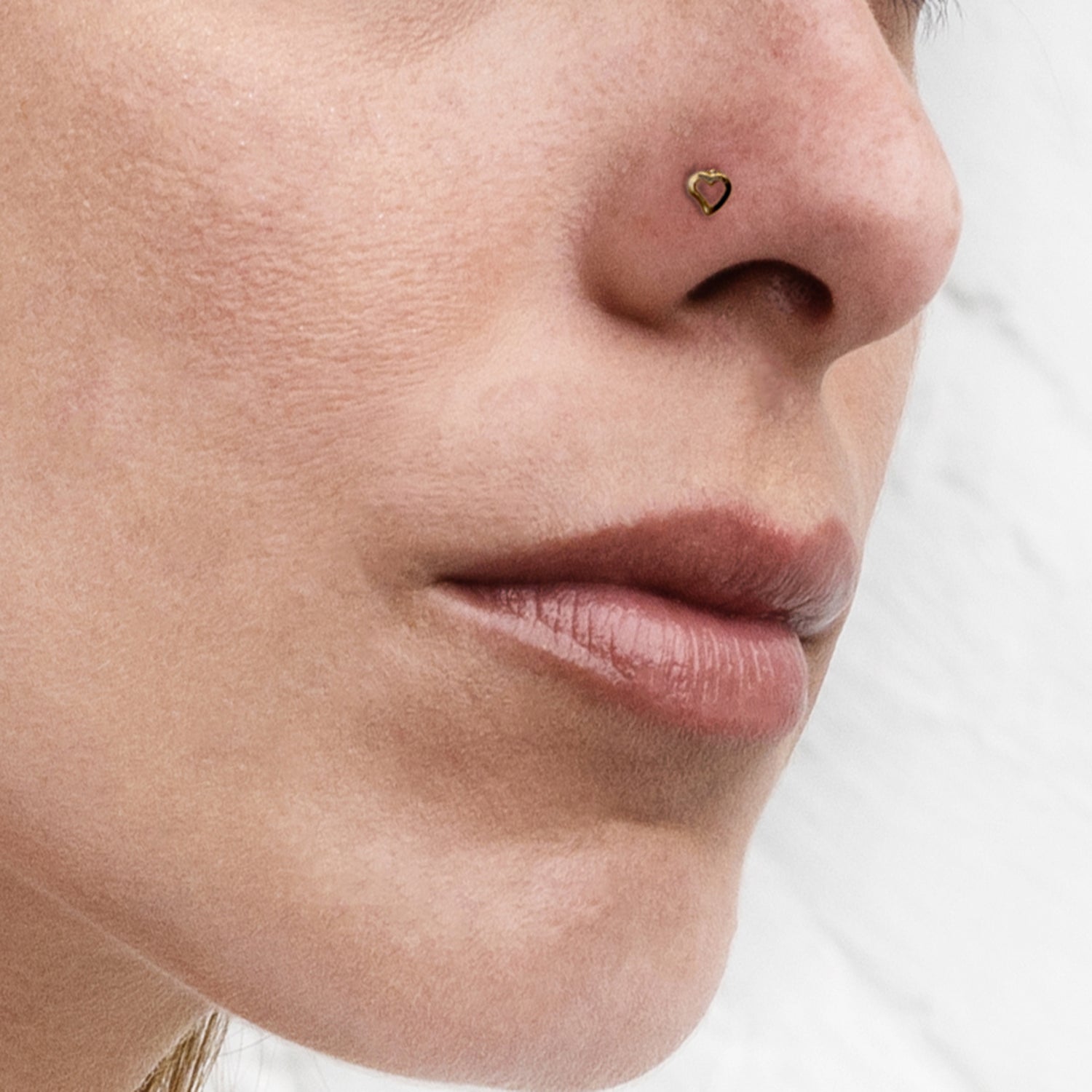 model wearing heart wire nose stud