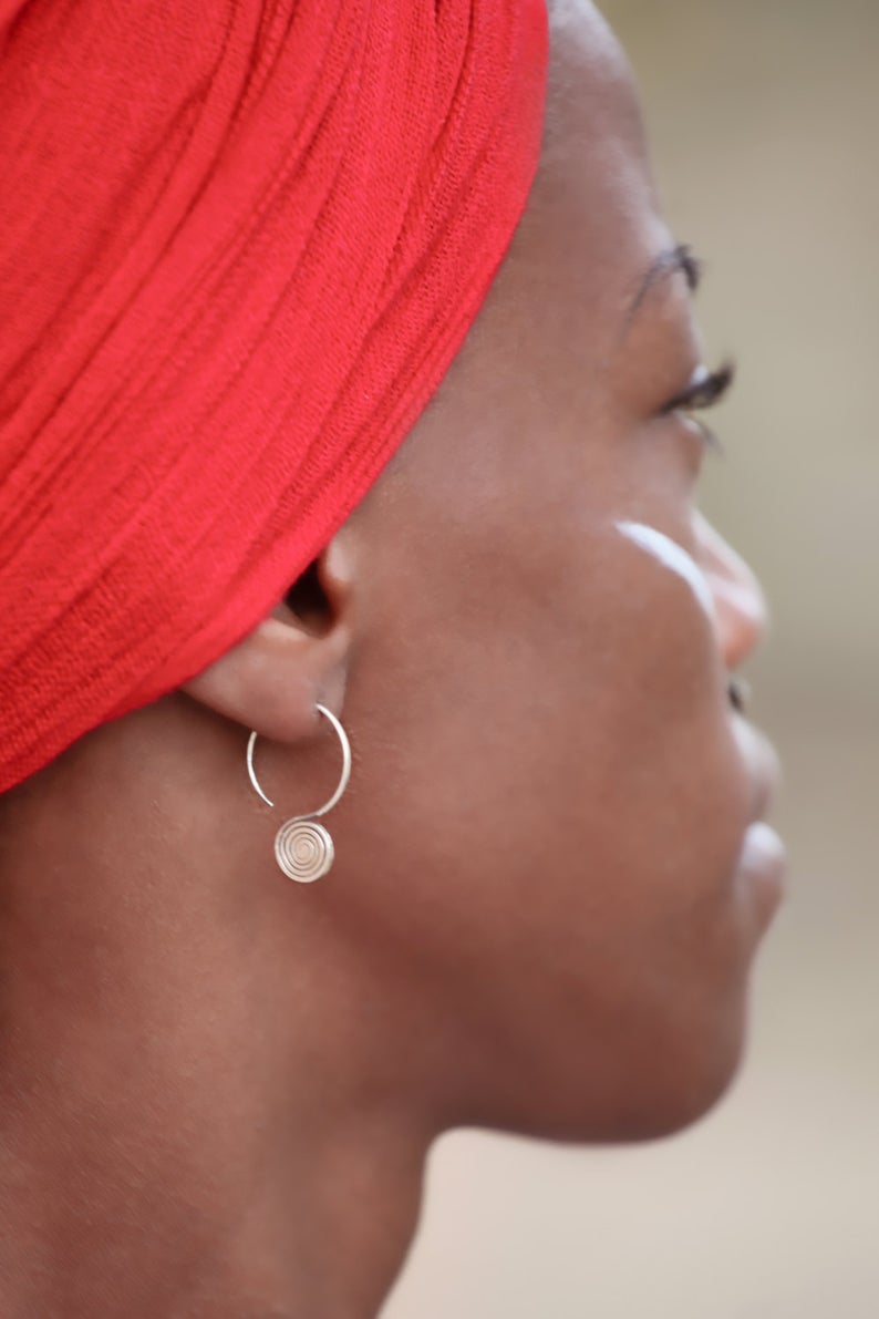 model wearing Spiral Engraved Tribal Silver Earrings