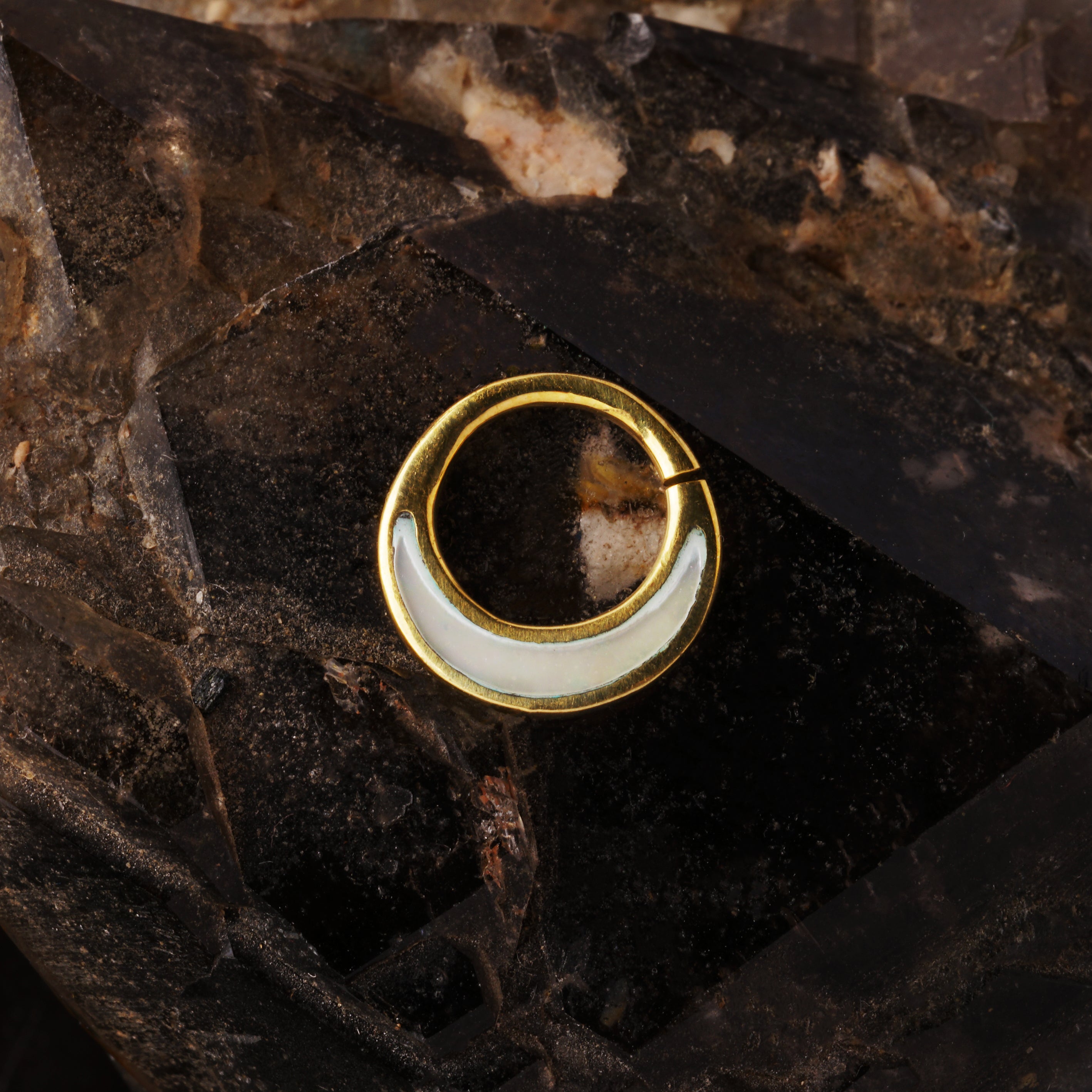 Golden brass septum piercing ring with mother of pearl inlay frontal view