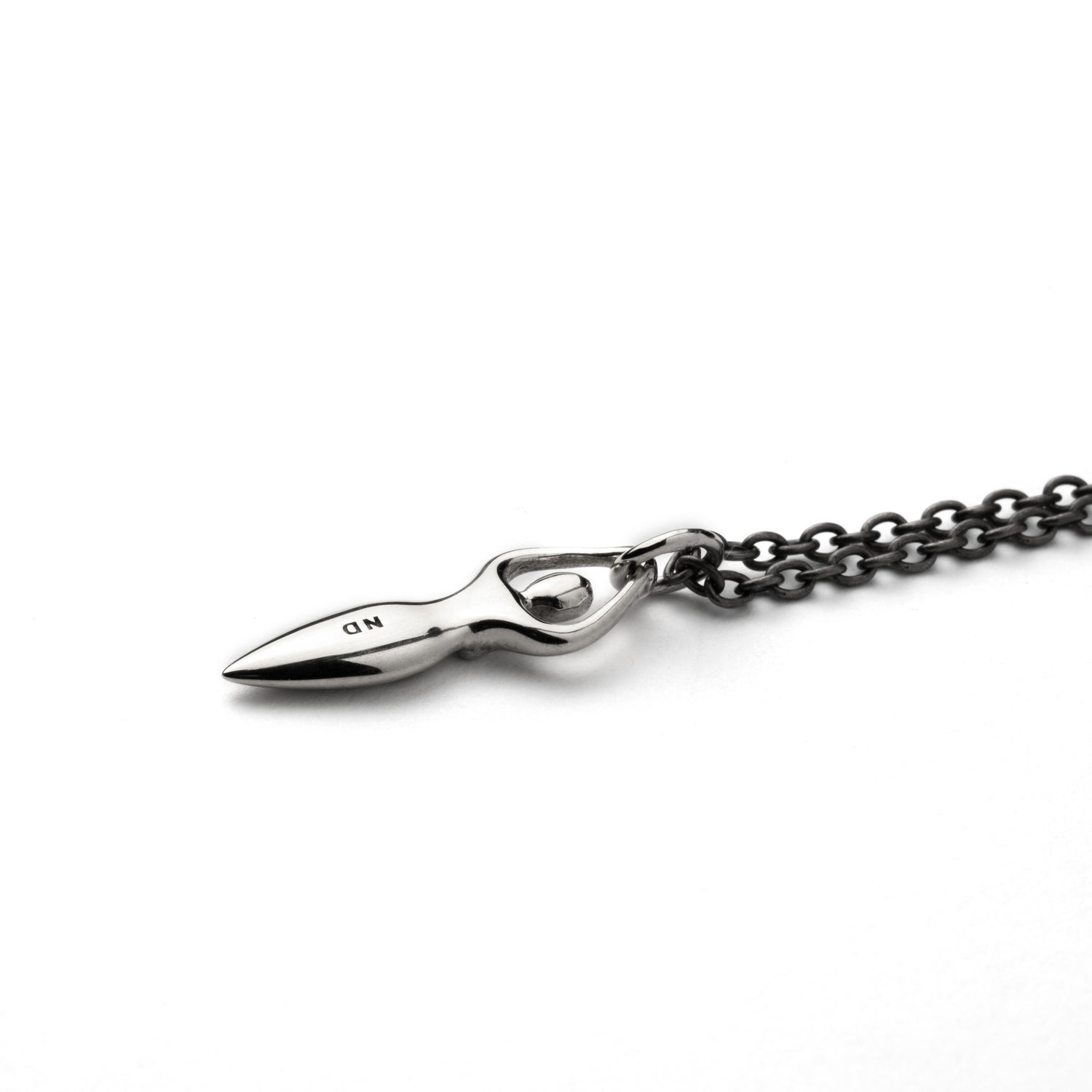 Tiny silver Fertility goddess with etched spiral charm on a necklace back view