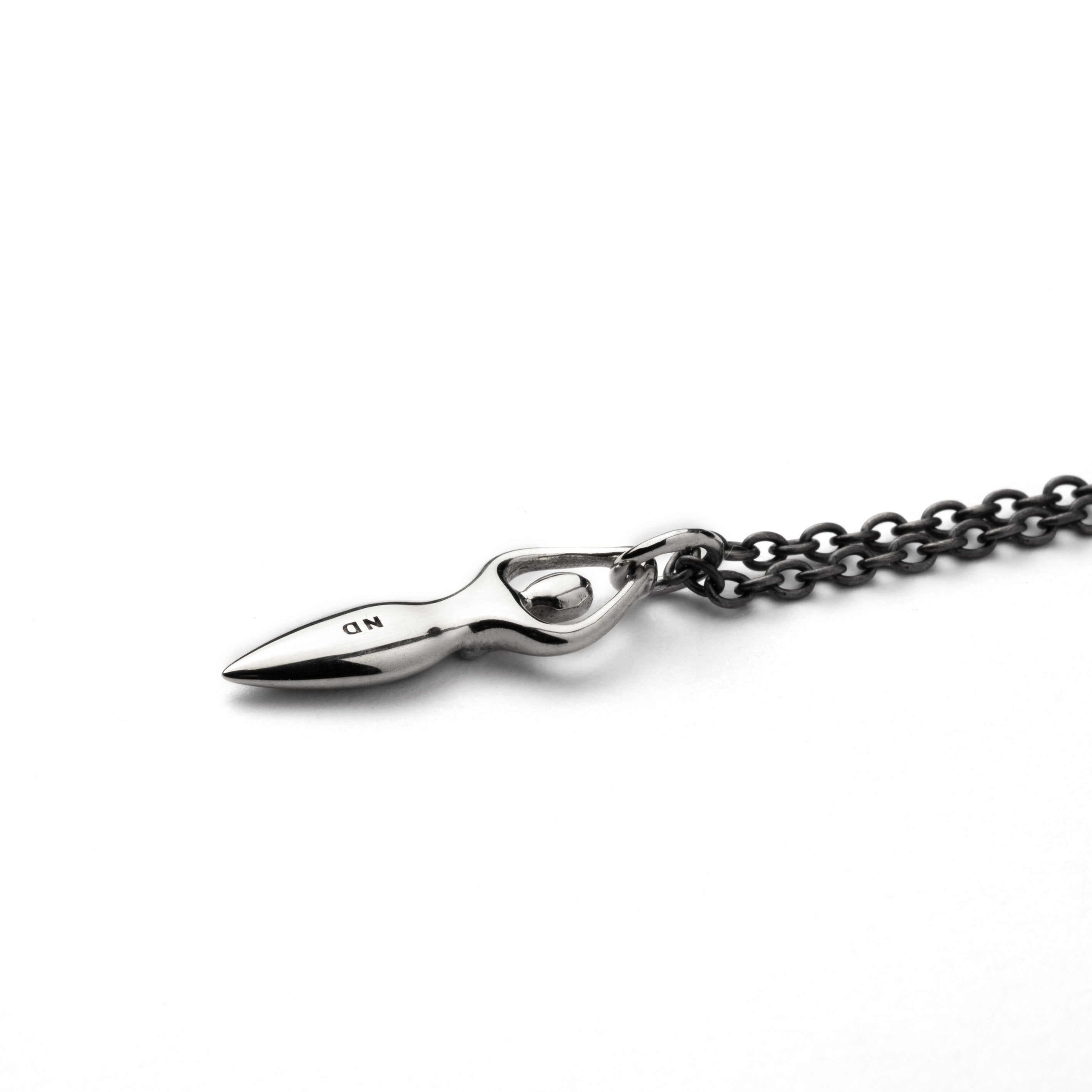 Tiny silver Fertility goddess with etched spiral charm on a necklace back view