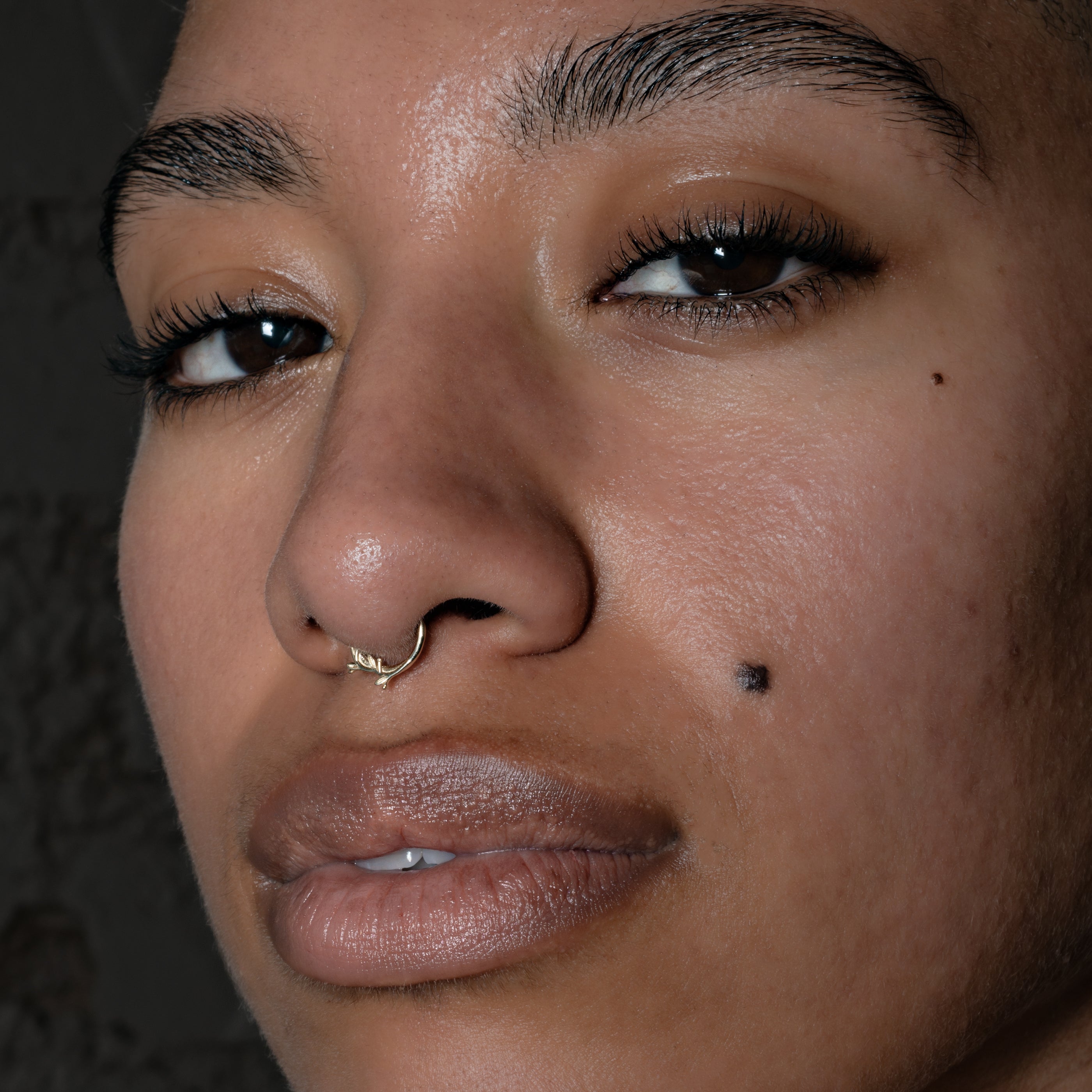 model wearing 14k Gold Twig Septum Clicker