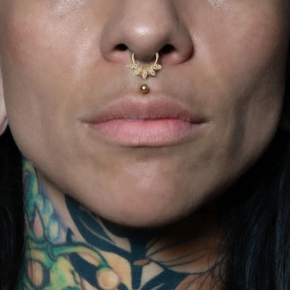 model wearing 14k Gold Zirconia Lotus Septum Clicker