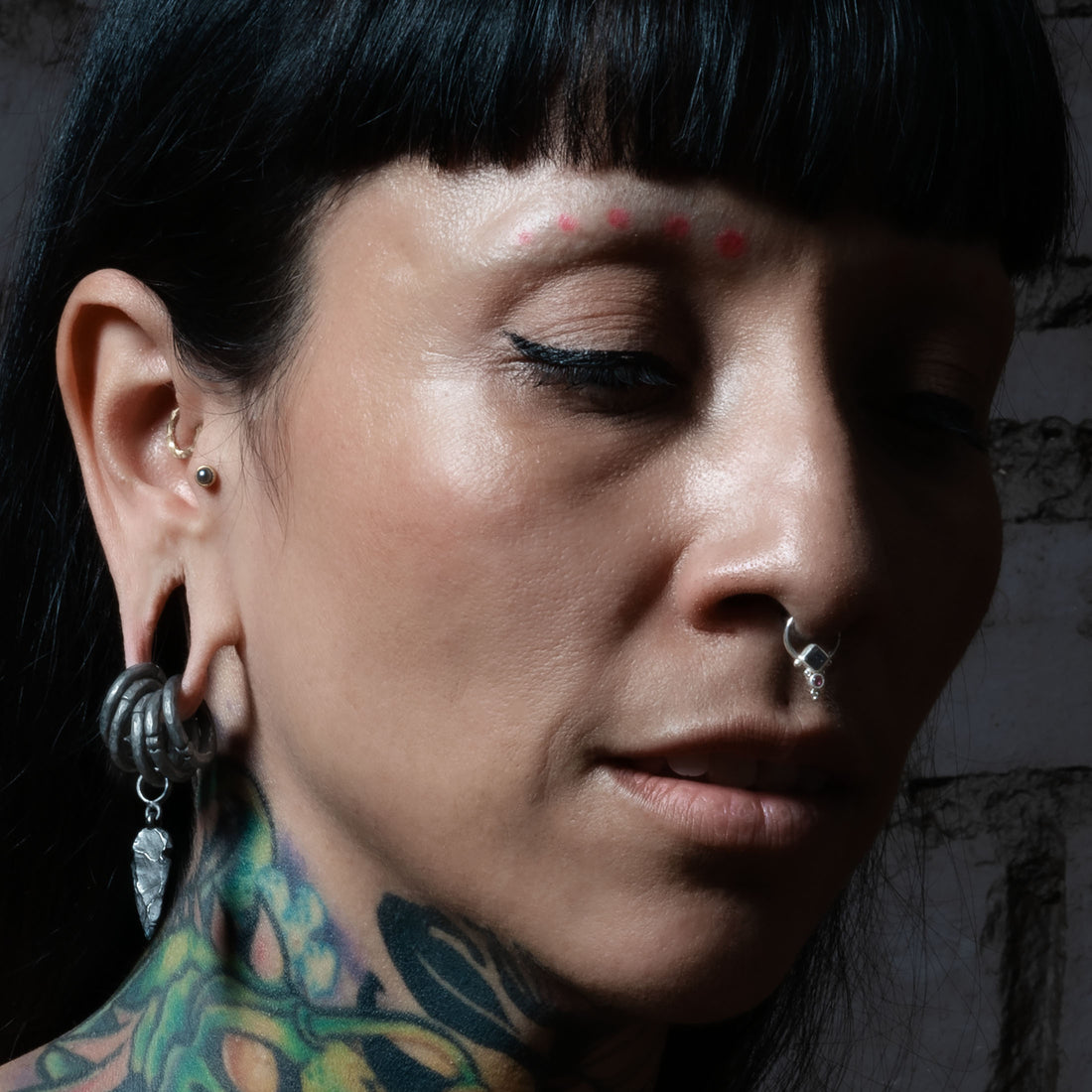 model wearing Golden Labret with Black Pearl on her tragus