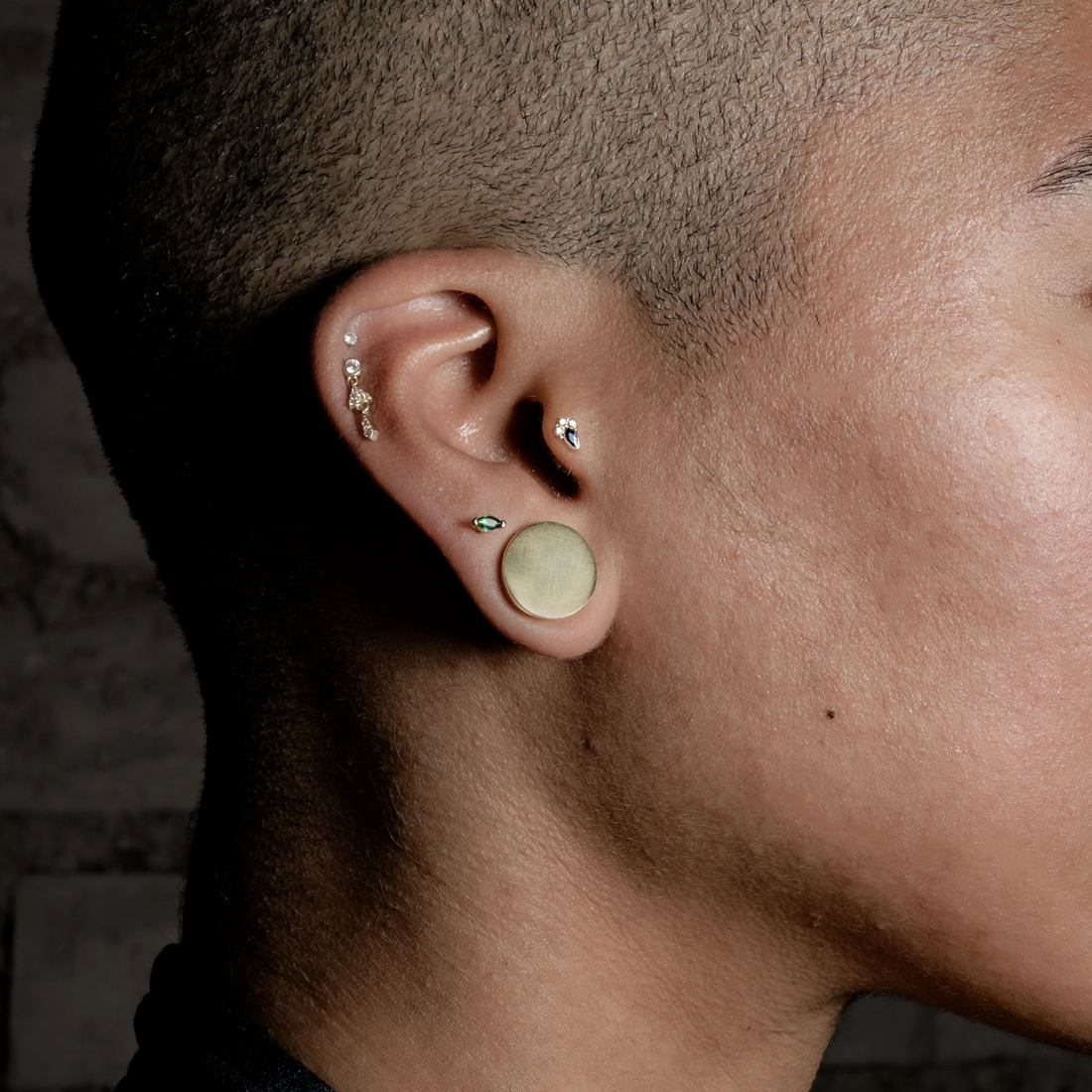 Model wearing Plain Brass Plug closeup