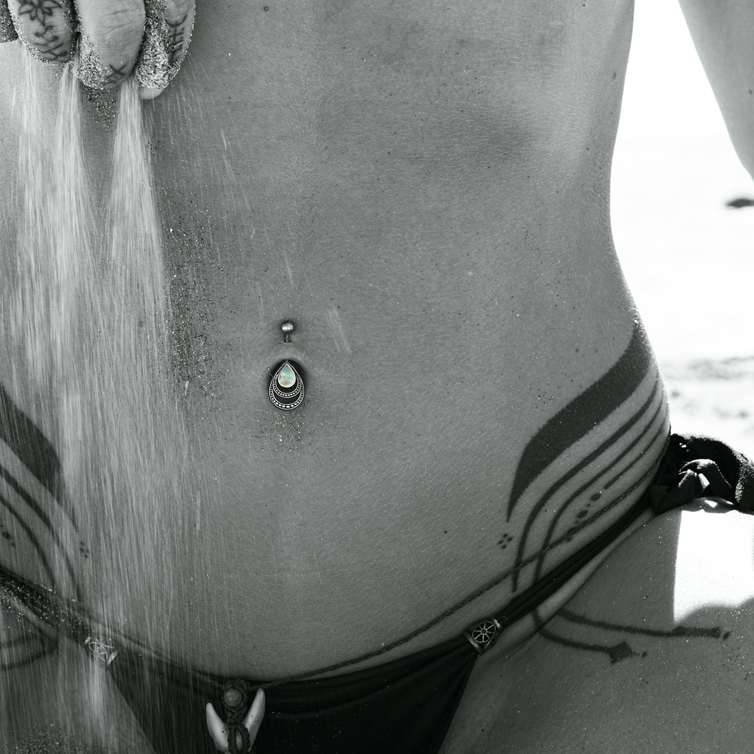 model wearing Silver Drop Mother of Pearl Belly Bar