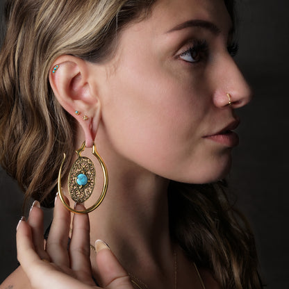 model wearing Golden Aurora Hangers with Turquoise