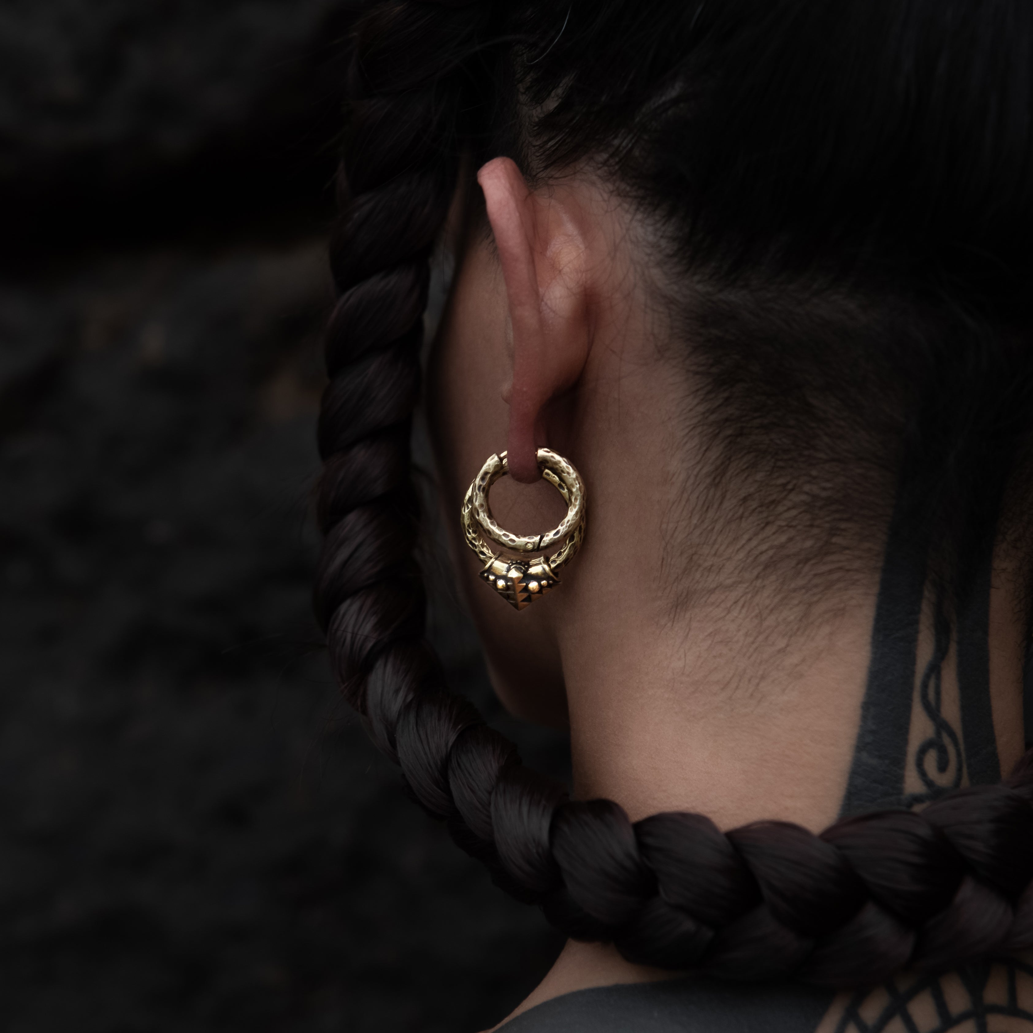 model wearing golden brass Karnataka Hoop Earrings