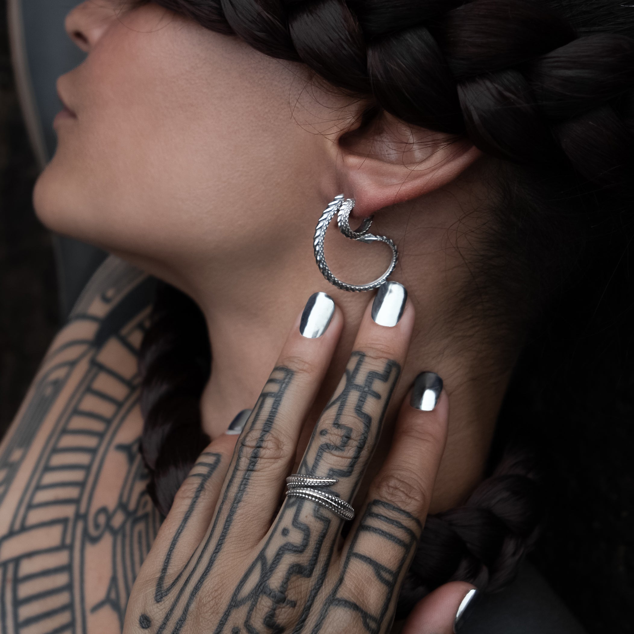 model wearing Silver Dragon Scale Ring and earrings