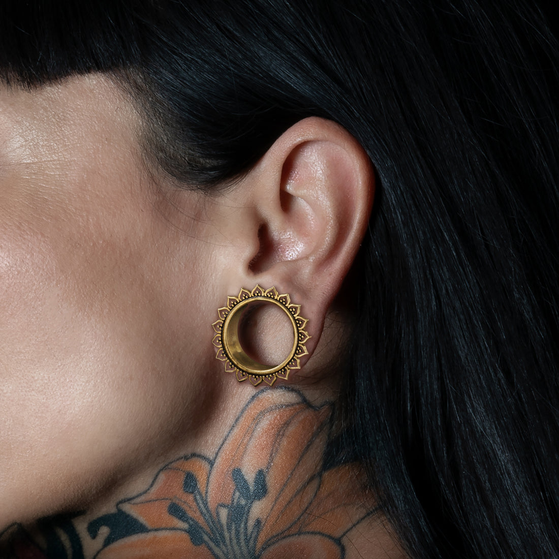 model wearing Iriya Lotus Petals Plug Tunnels