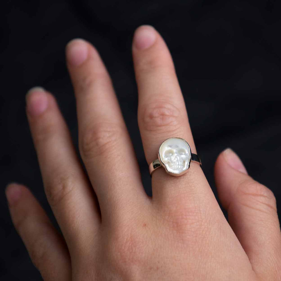 model wearing Mother Of Pearl Skull Ring