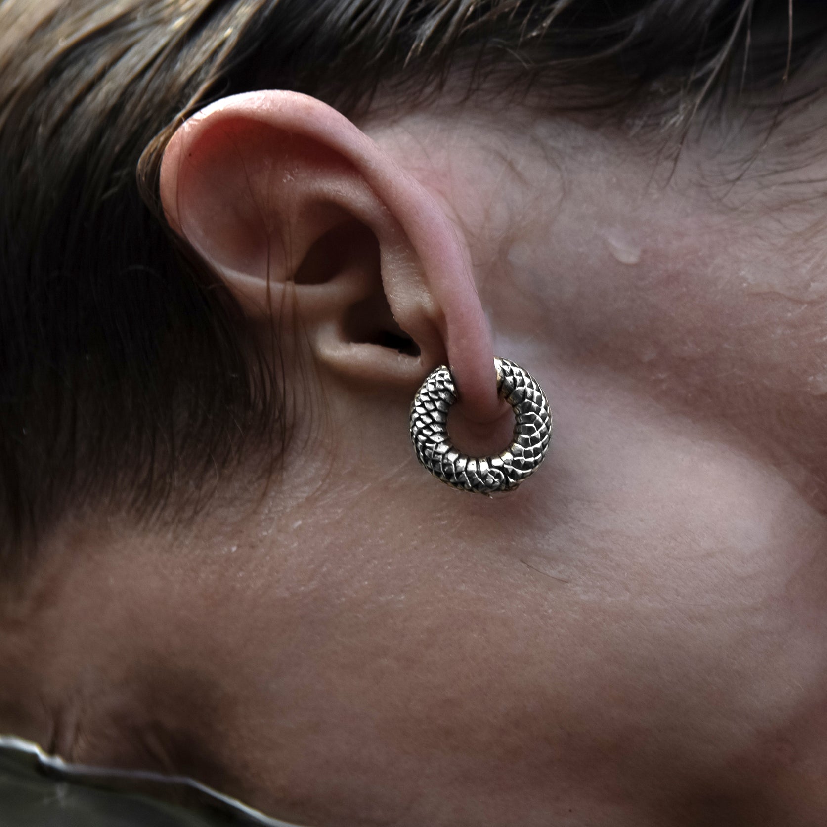 model wearing Rebirth Silver Clicker Earrings