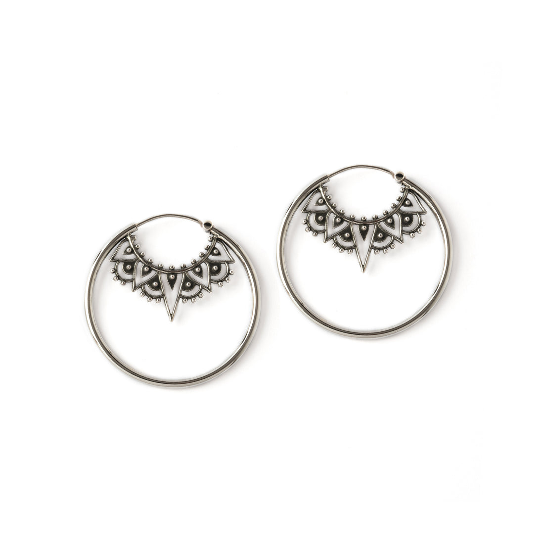sterling silver large hoop earrings framing an ethnic filigree collar ornament frontal view
