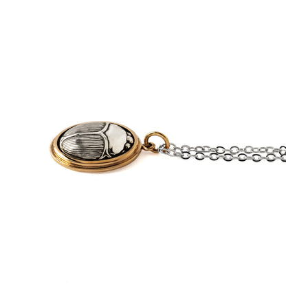 Silver and bronze Scarab Pendant on a chain side view
