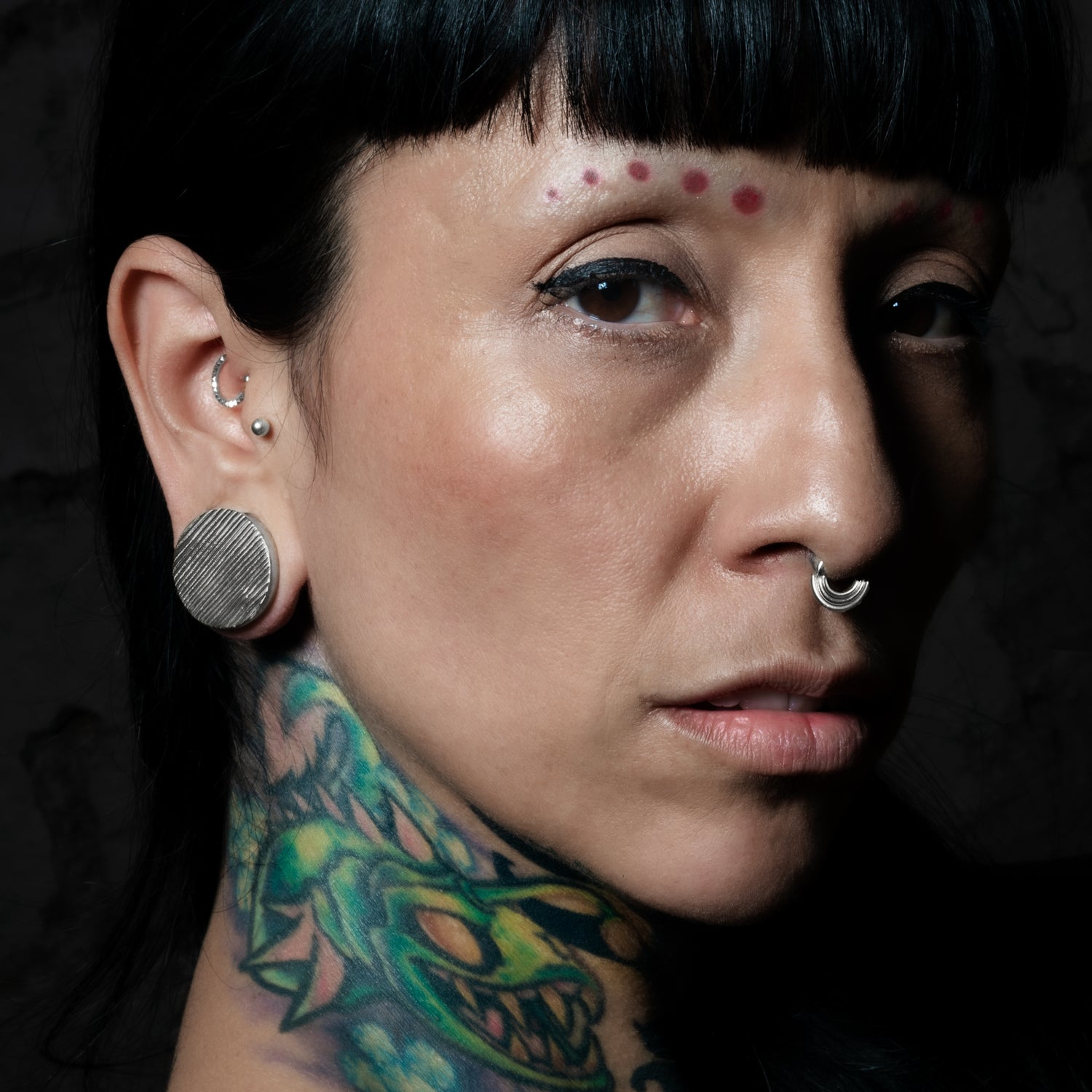 model wearing Scratched Silver Plugs
