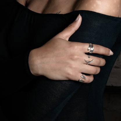model wearing Celestial Ring, feather ring and wing ring