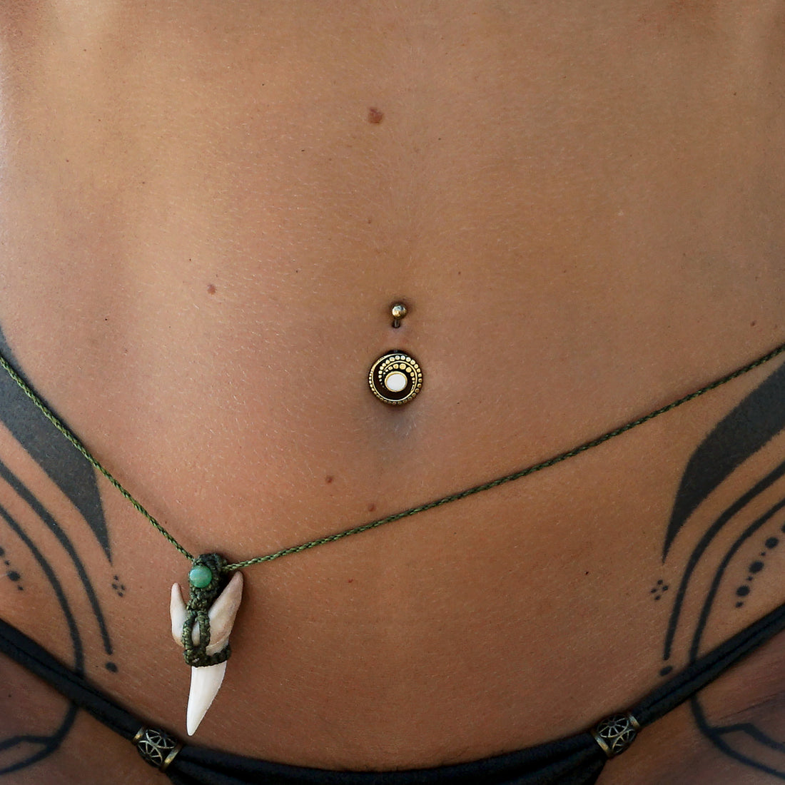 model wearing Spiral Mother of Pearl Belly Bar