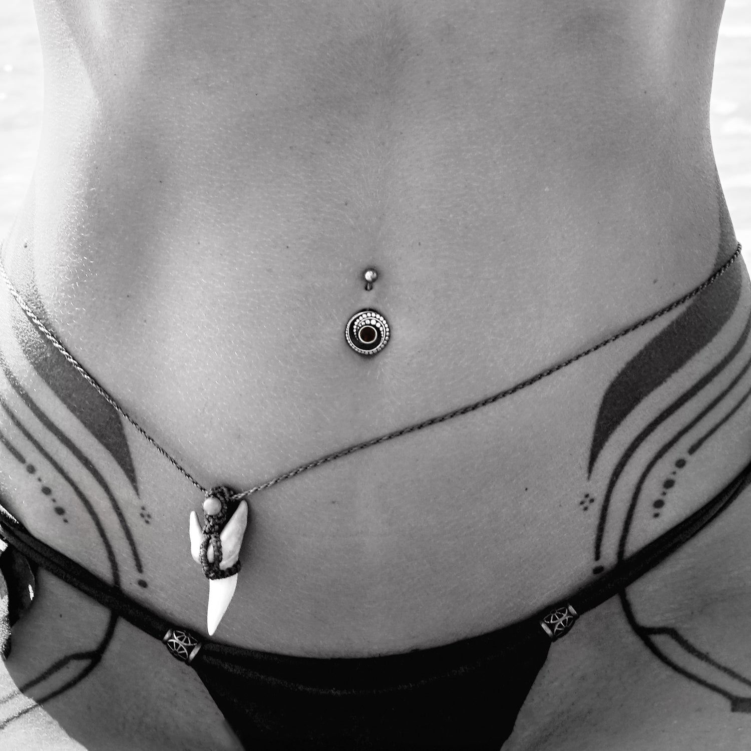 model wearing Spiral Crop Onyx Belly Bar